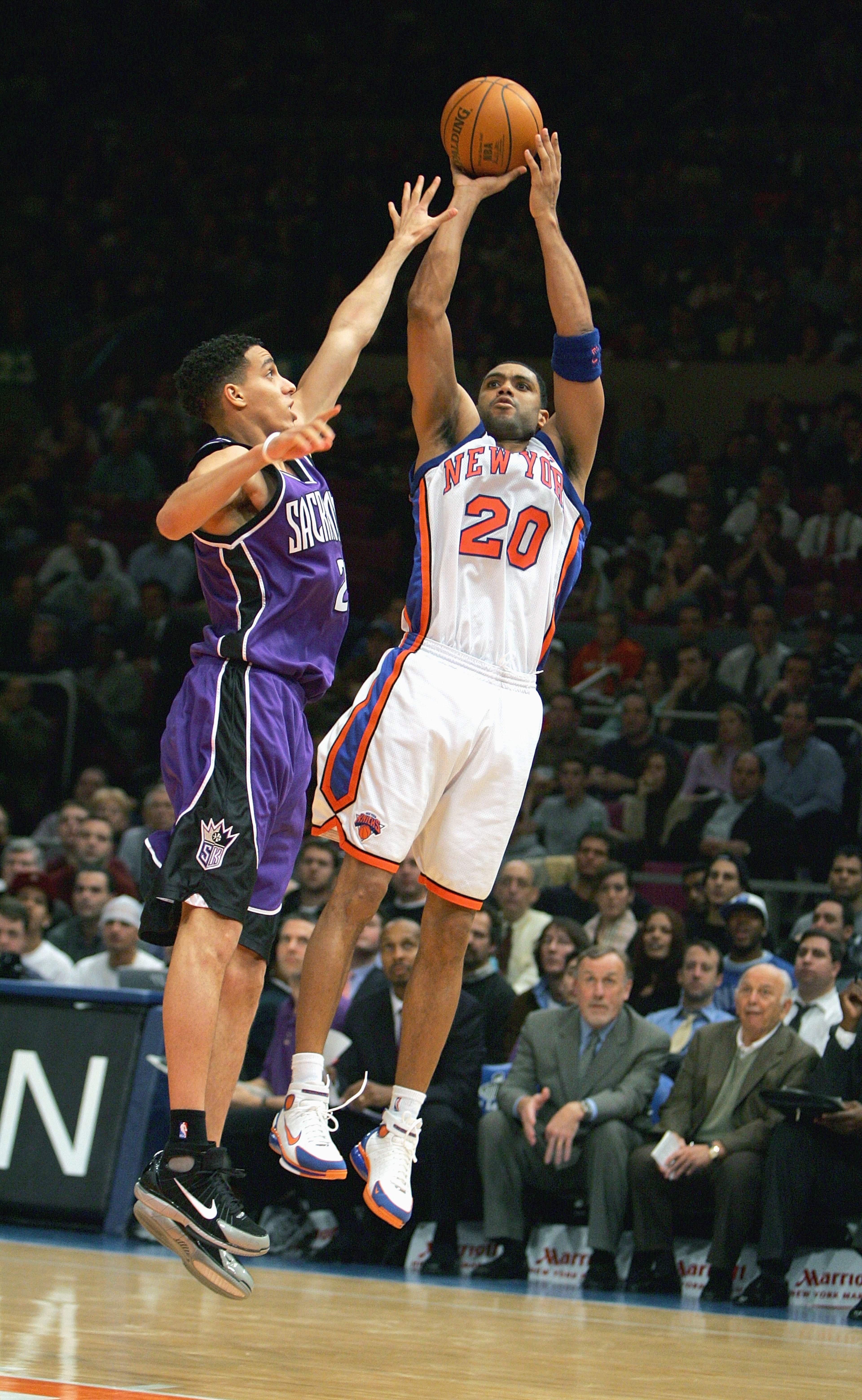 NEW YORK - JANUARY 4: Allan Houston #20 of the New York Knicks shoots a jump shot against Kevin Martin #23 of the Sacramento Kings on January 4, 2005 at Madison Square Garden in New York City. The Kings won 105-98. NOTE TO USER: User expressly acknowled NEW YORK - JANUARY 4: Allan Houston #20 of the New York Knicks shoots a jump shot against Kevin Martin #23 of the Sacramento Kings on January 4, 2005 at Madison Square Garden in New York City. The Kings won 105-98. NOTE TO USER: User expressly acknowled