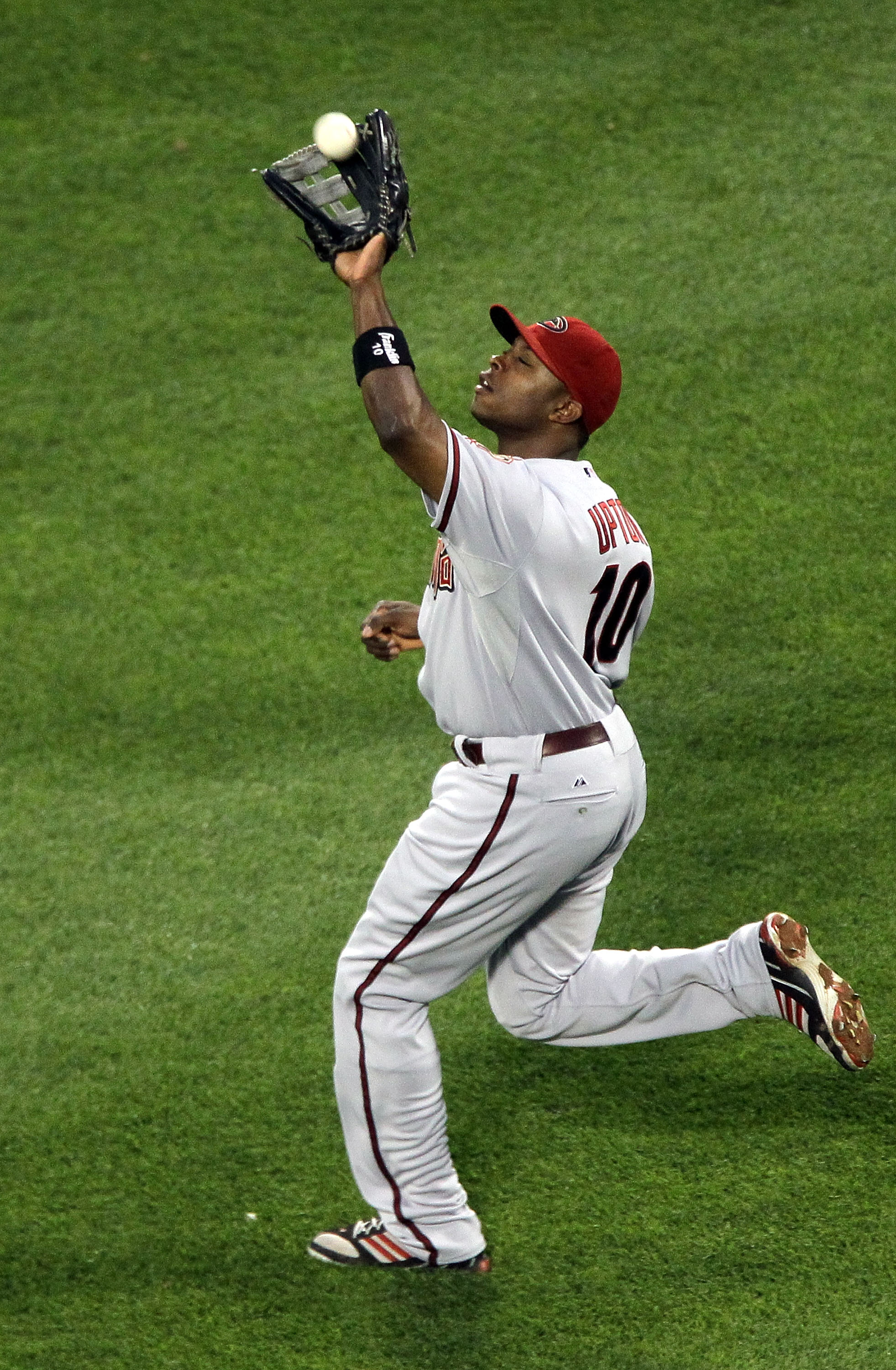 NEW YORK - JULY 31:  Justin Upton #10 of the Arizona Diamondbacks in action against the New York Mets on July 31, 2010 at Citi Field in the Flushing neighborhood of the Queens borough of New York City.  (Photo by Jim McIsaac/Getty Images)