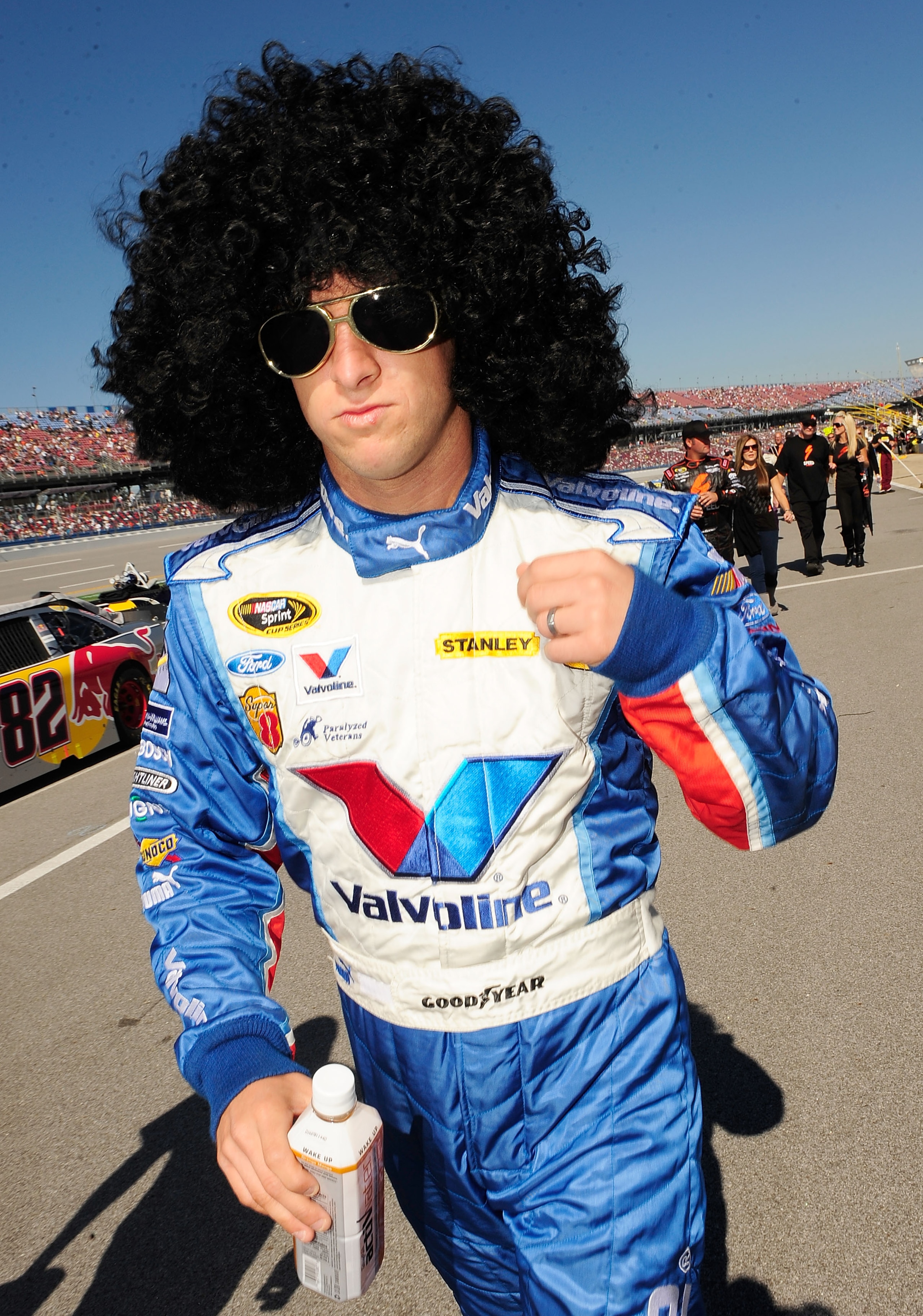 TALLADEGA, AL - OCTOBER 31:  AJ Allmendinger, driver of the #43 Valvoline Ford walk to pre-race activities for the NASCAR Sprint Cup Series AMP Energy Juice 500 at Talladega Superspeedway on October 31, 2010 in Talladega, Alabama.  (Photo by Rusty Jarrett