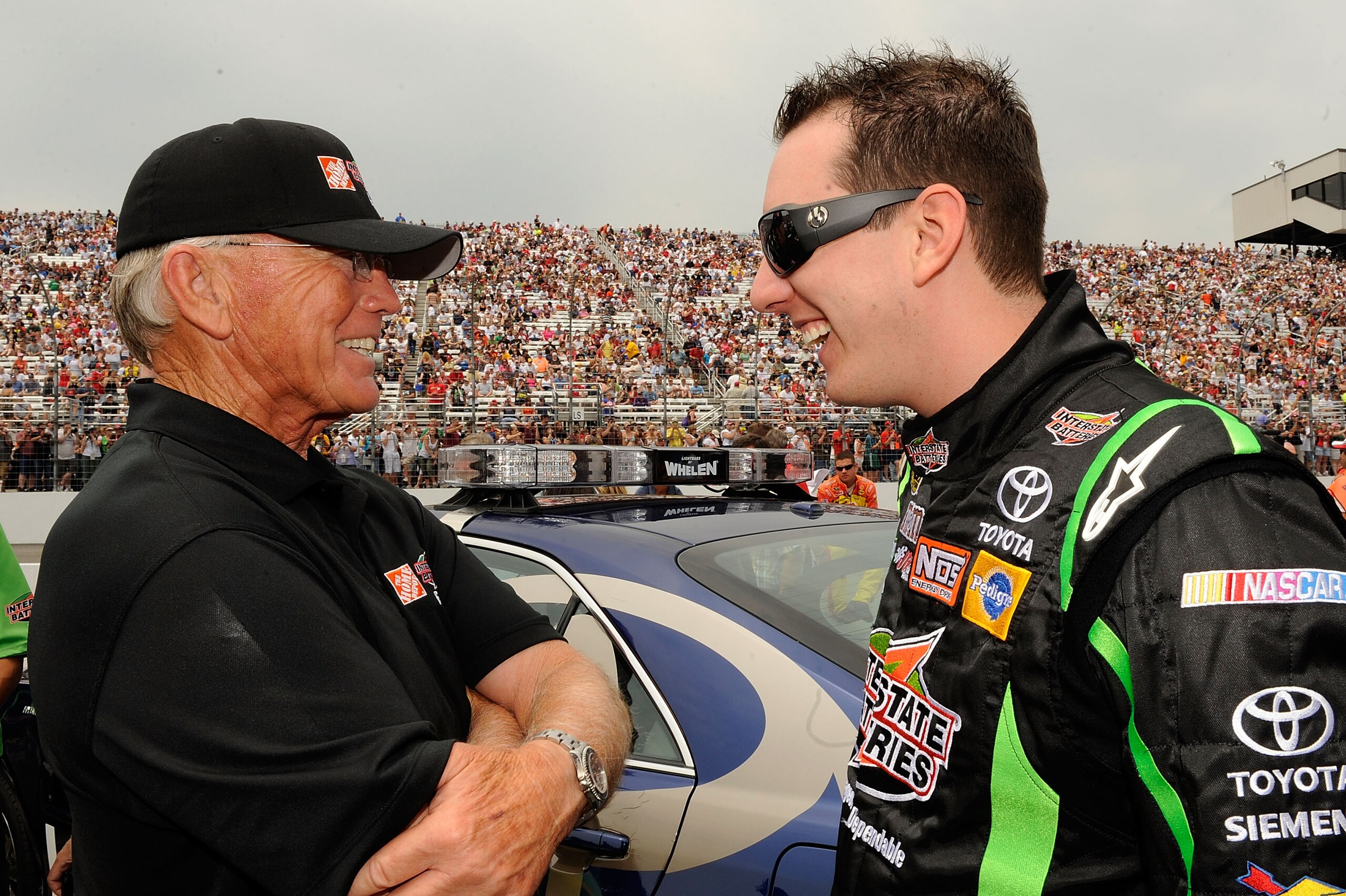 LOUDON, NH - JUNE 27:  Kyle Busch (R), driver of the #18 Interstate Batteries Toyota, talks with team owner Joe Gibbs on the grid prior to the start of the NASCAR Sprint Cup Series LENOX Industrial Tools 301 at New Hampshire Motor Speedway on June 27, 201