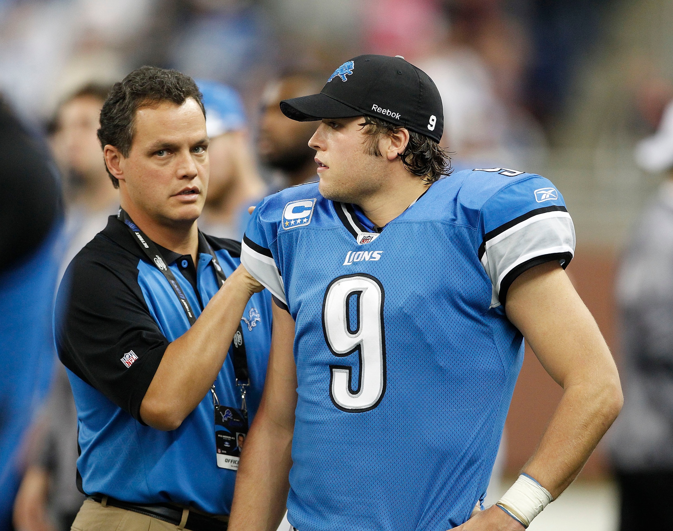 DETROIT - NOVEMBER 07: Detroit Lions team doctor Kyle Anderson checks the right shoulder of Matthew Stafford #9 of the Detroit Lions after leaving the game during the third quarter of the game at Ford Field on November 7, 2010 in Detroit, Michigan. The Je