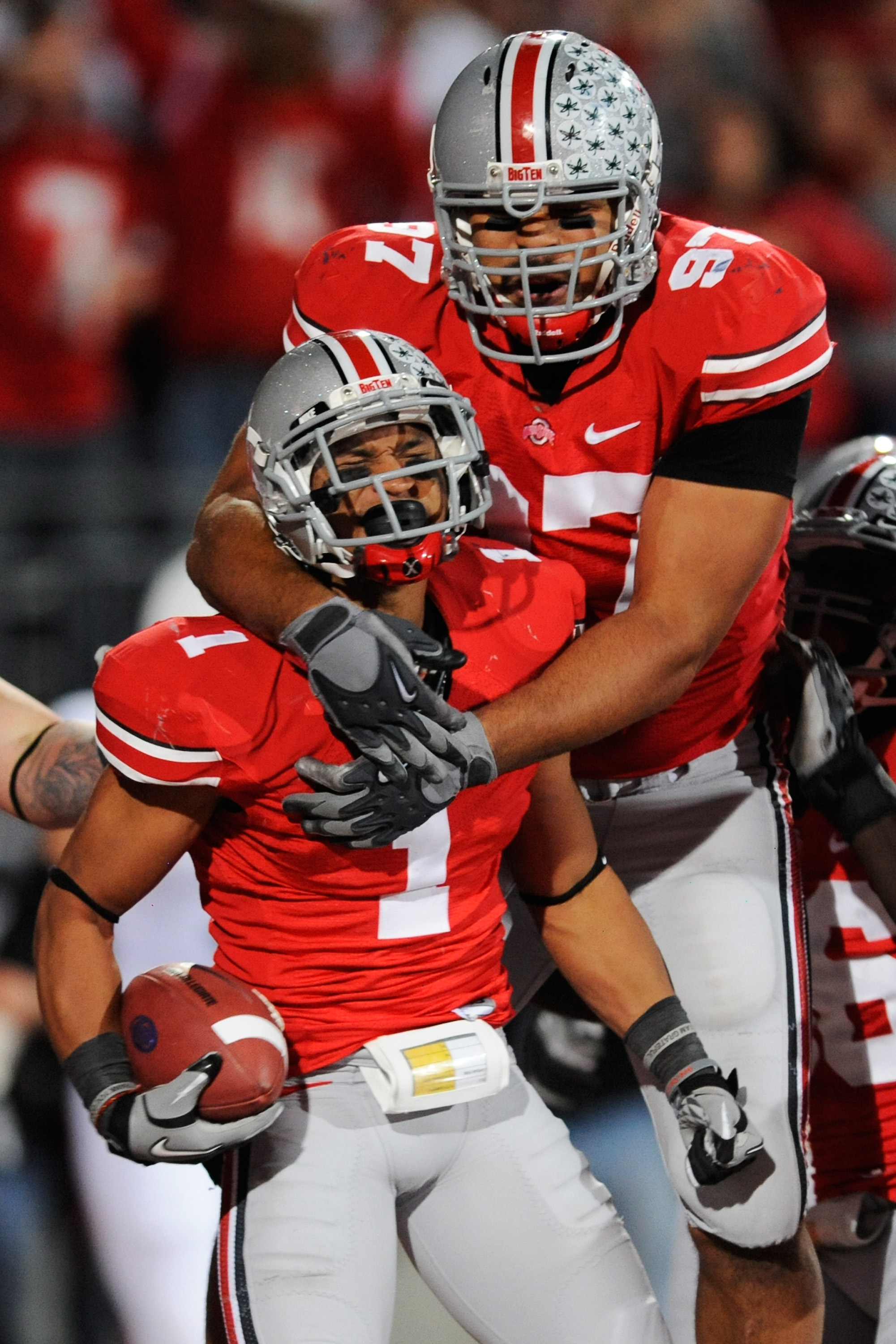COLUMBUS, OH - NOVEMBER 13: Cameron Heyward #97 of the Ohio State Buckeyes celebrates with Devon Torrence #1 of the Ohio State Buckeyes after Torrence returned an interception 34-yards for a touchdown against the Penn State Nittany Lions at Ohio Stadium