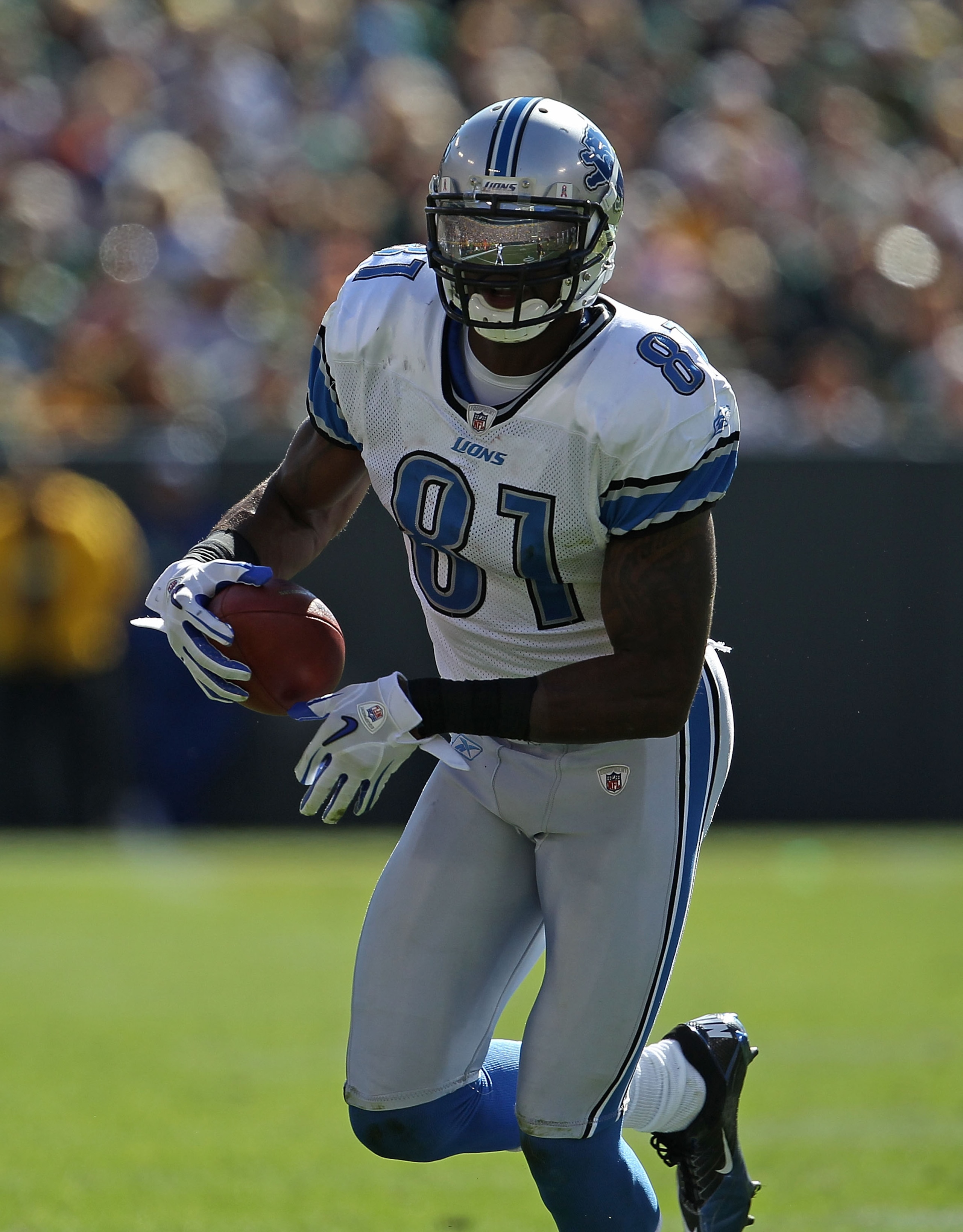 GREEN BAY, WI - OCTOBER 03: Calvin Johnson #81 of the Detroit Lions runs toward the end zone against the Green Bay Packers at Lambeau Field on October 3, 2010 in Green Bay, Wisconsin. The Packers defeated the Lions 28-26. (Photo by Jonathan Daniel/Getty I