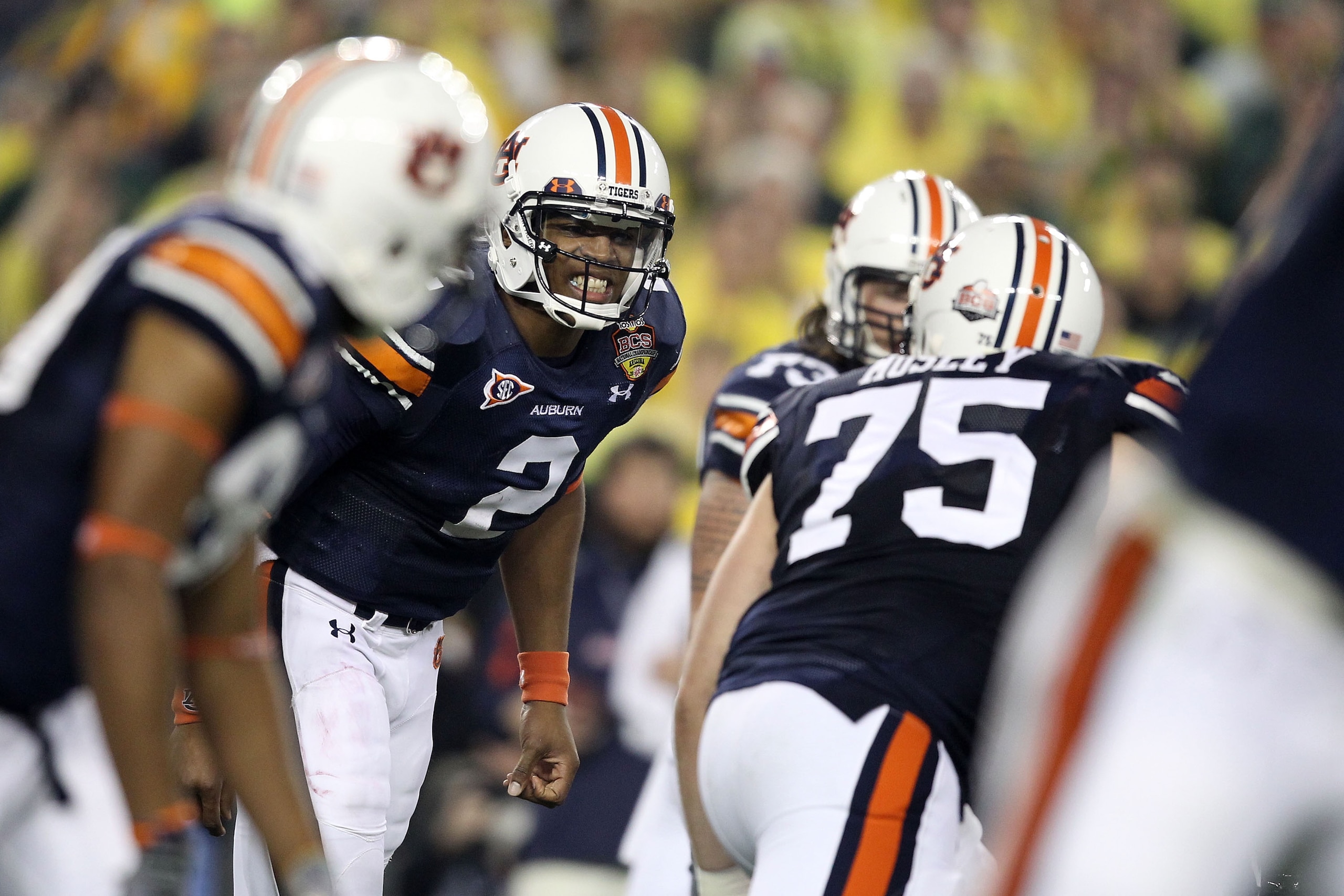 GLENDALE, AZ - JANUARY 10: Cameron Newton #2 of the Auburn Tigersc reacts with his team against the Oregon Ducks during the Tostitos BCS National Championship Game at University of Phoenix Stadium on January 10, 2011 in Glendale, Arizona. (Photo by Chri GLENDALE, AZ - JANUARY 10: Cameron Newton #2 of the Auburn Tigersc reacts with his team against the Oregon Ducks during the Tostitos BCS National Championship Game at University of Phoenix Stadium on January 10, 2011 in Glendale, Arizona. (Photo by Chri