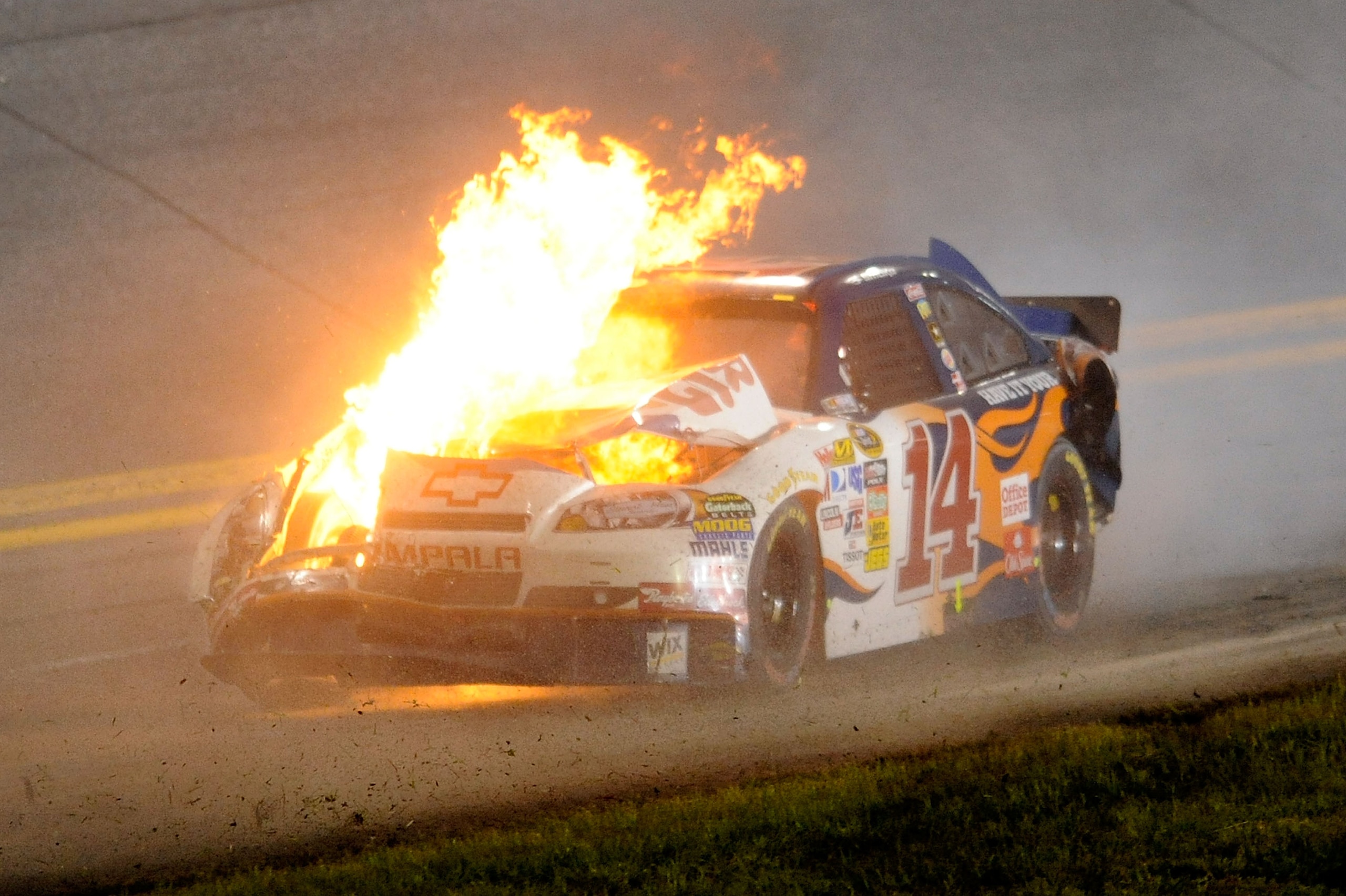 DAYTONA BEACH, FL - JULY 03:  The car of Tony Stewart, driver of the #14 Burger King Chevrolet, is engulfed in flames after crashing during the NASCAR Sprint Cup Series Coke Zero 400 at Daytona International Speedway on July 3, 2010 in Daytona Beach, Flor