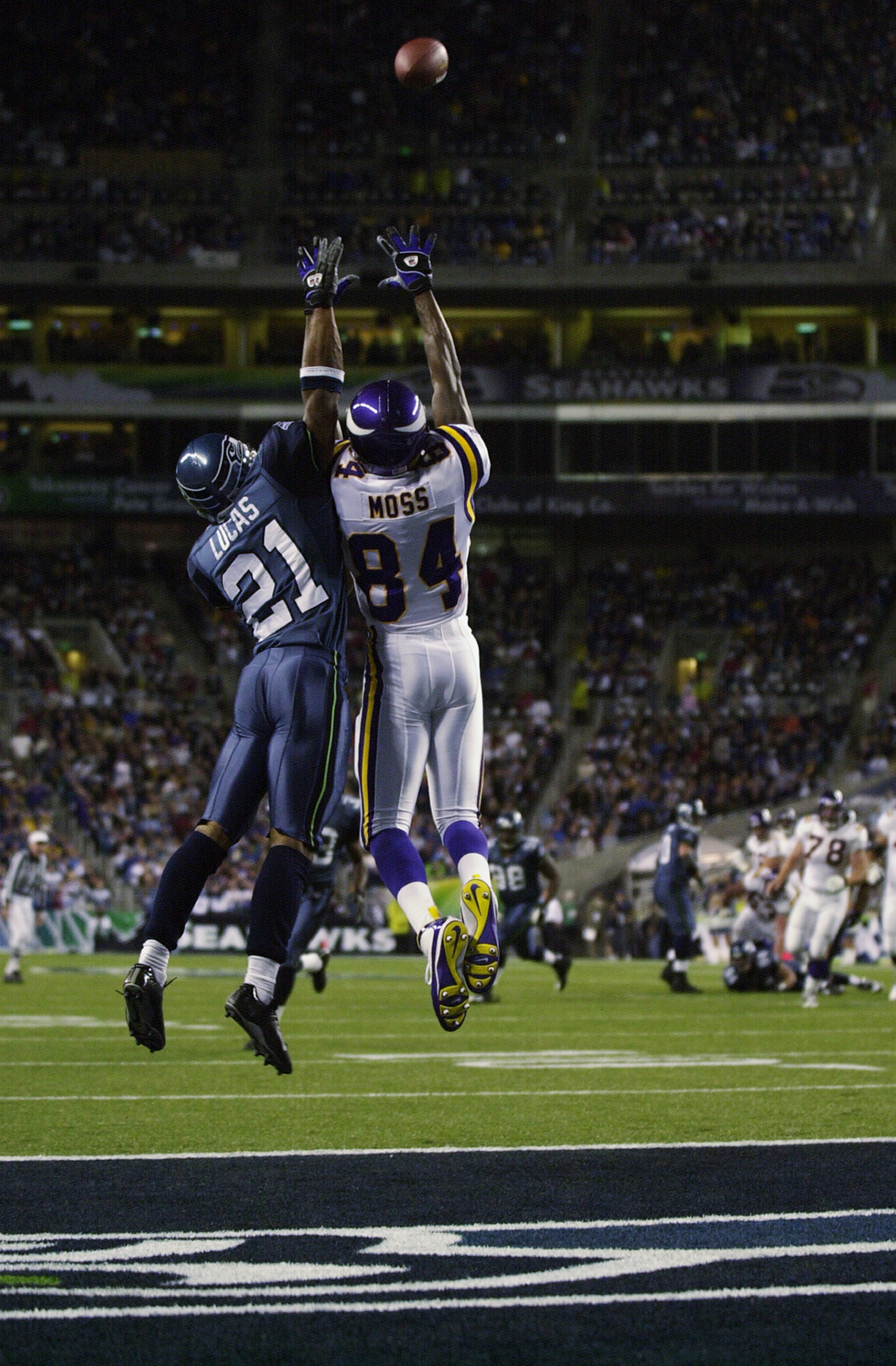 SEATTLE - SEPTEMBER 29: Randy Moss #84 of the Minnesota Vikings leaps for the ball against Ken Lucas #21 of the Seattle Seahawks during the game on September 29, 2002 at Seahawks Stadium in Seattle, Washington. The ball was batted away by Chavous. The SEATTLE - SEPTEMBER 29: Randy Moss #84 of the Minnesota Vikings leaps for the ball against Ken Lucas #21 of the Seattle Seahawks during the game on September 29, 2002 at Seahawks Stadium in Seattle, Washington. The ball was batted away by Chavous. The