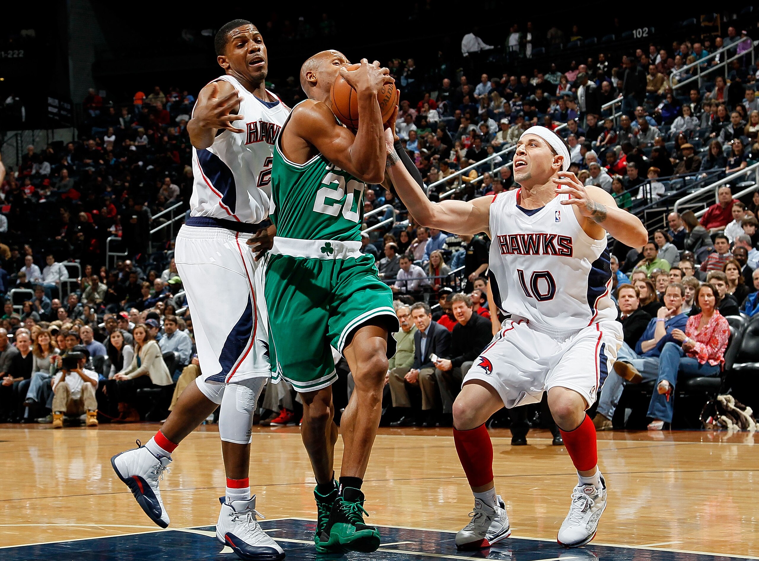 ATLANTA - JANUARY 29:  Joe Johnson #2 of the Atlanta Hawks defends as Mike Bibby #10 attempts to steal the ball from Ray Allen #20 of the Boston Celtics at Philips Arena on January 29, 2010 in Atlanta, Georgia.  NOTE TO USER: User expressly acknowledges a