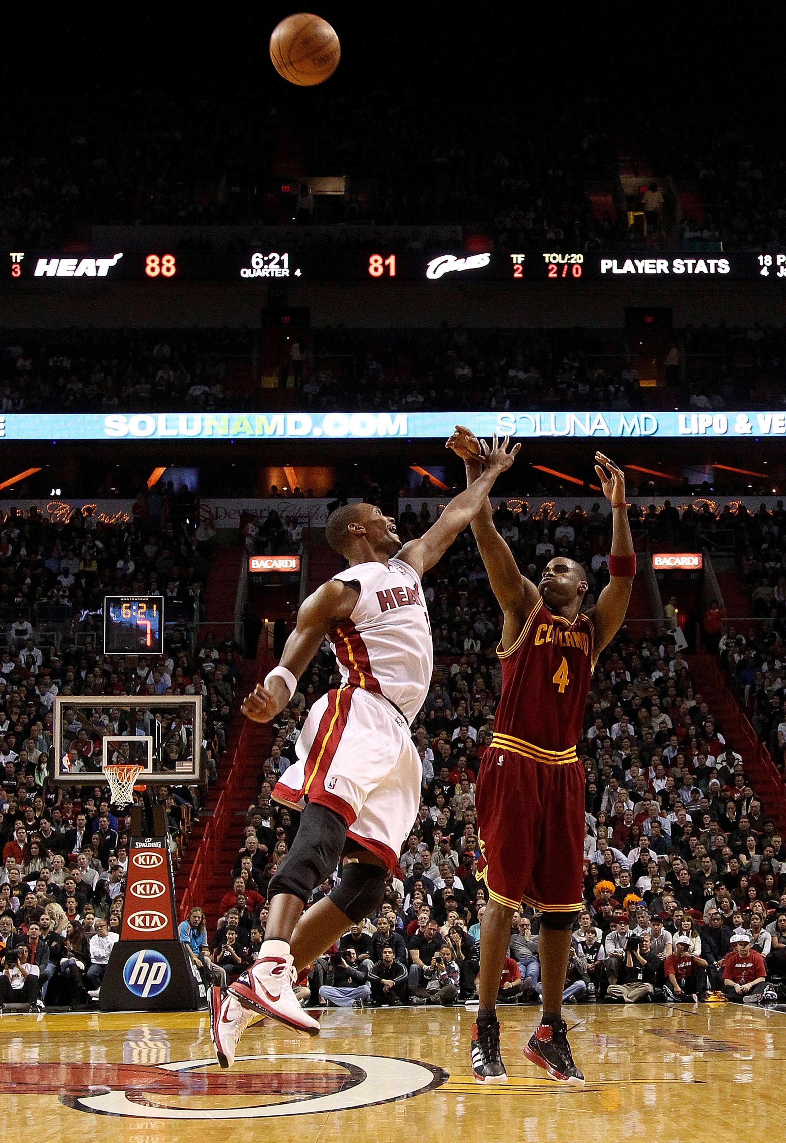 MIAMI, FL - DECEMBER 15:  Antawn Jamison #4 of the Cleveland Cavaliersshoots over Chris Bosh #1 of the Miami Heat during a game at American Airlines Arena on December 15, 2010 in Miami, Florida. NOTE TO USER: User expressly acknowledges and agrees that, b