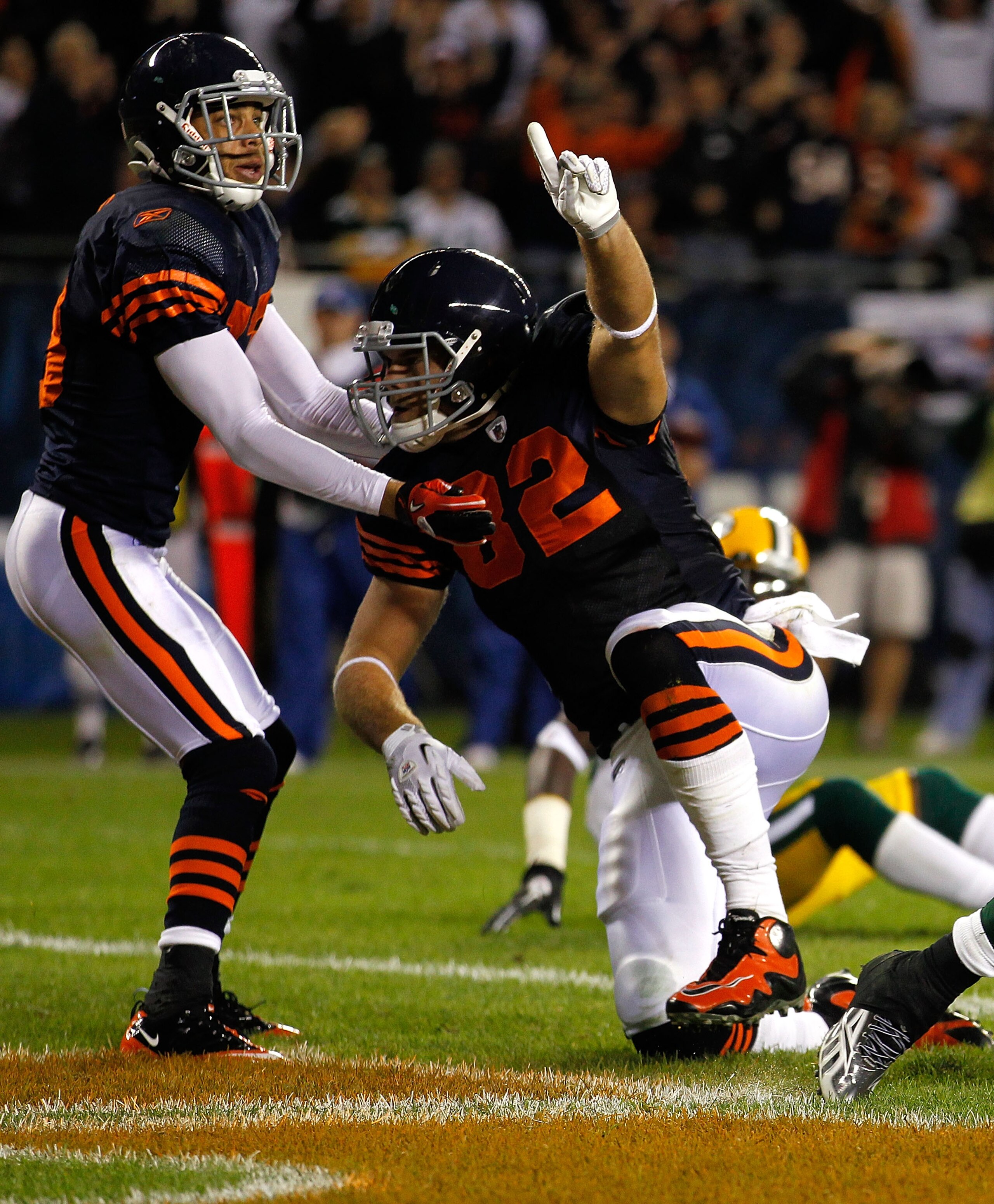 CHICAGO - SEPTEMBER 27:  (L-R) Johnny Knox #13 and Greg Olsen #82 of the Chicago Bears celebrate after Olsen scored a 9-yard touchdown in the second quarter against the Green Bay Packers at Soldier Field on September 27, 2010 in Chicago, Illinois.  (Photo