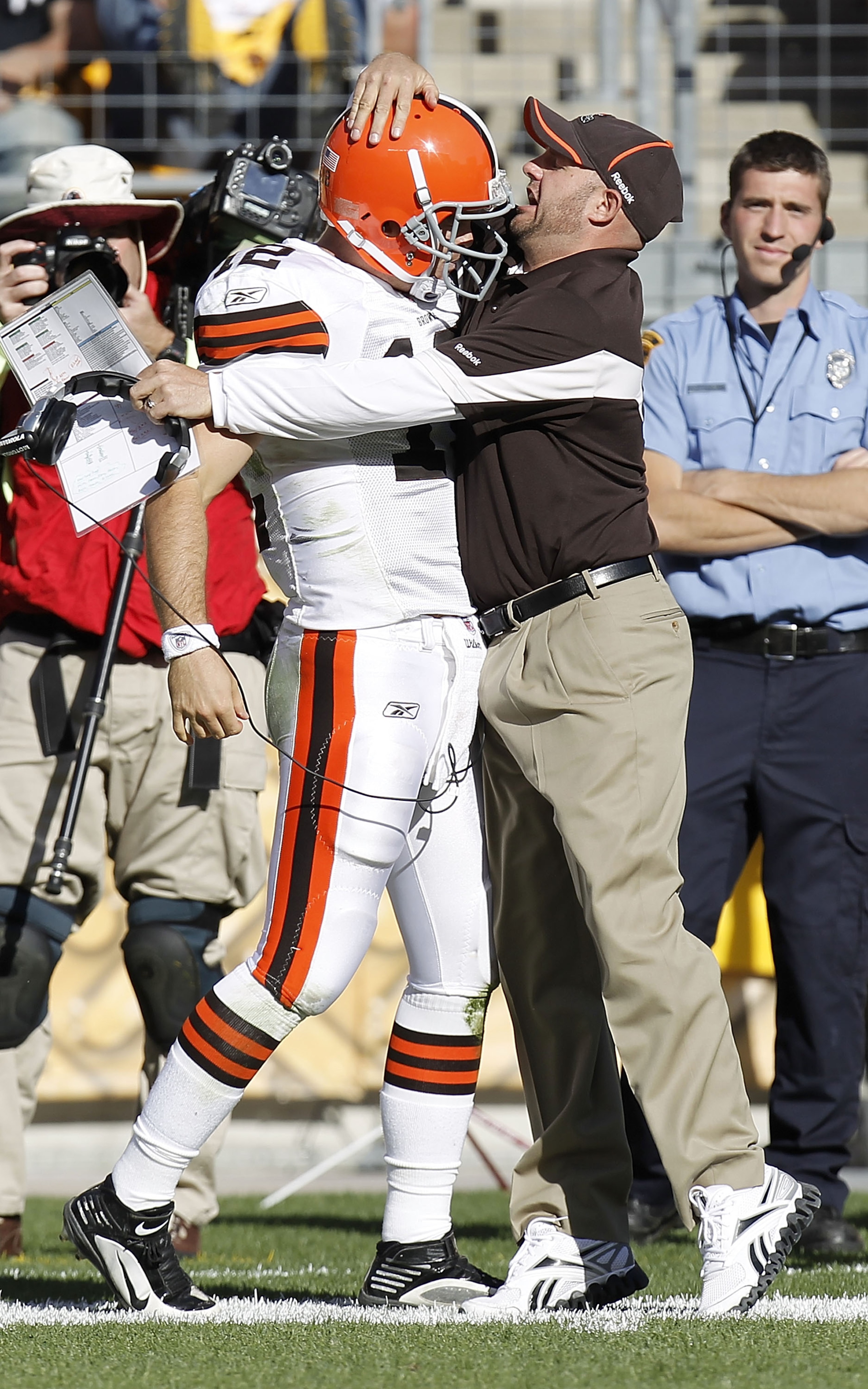 PITTSBURGH - OCTOBER 17:  Colt McCoy #12 of the Cleveland Browns celebrates his first touchdown pass in the NFL with offensive coordinaton Brian Daboll while playing the Pittsburgh Steelers on October 17, 2010 at Heinz Field in Pittsburgh, Pennsylvania. P