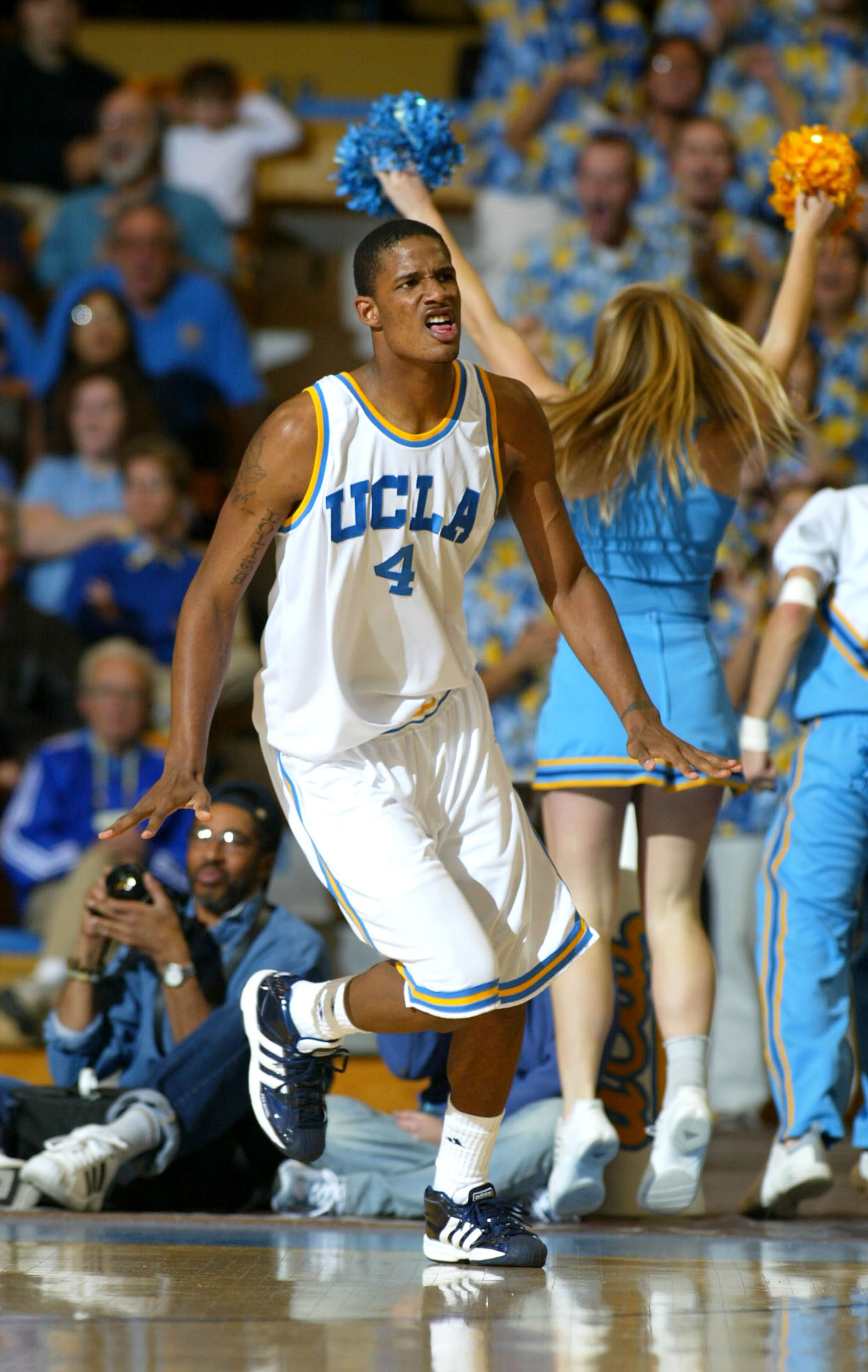 WESTWOOD, CA - FEBRUARY 19:  Trevor Ariza #4 of the UCLA Bruins celebrates after a basket during the first half against the California State Golden Bears on February 19, 2004 at Pauley Pavillion in Westwood, California.  (Photo by Lisa Blumenfeld/Getty Im