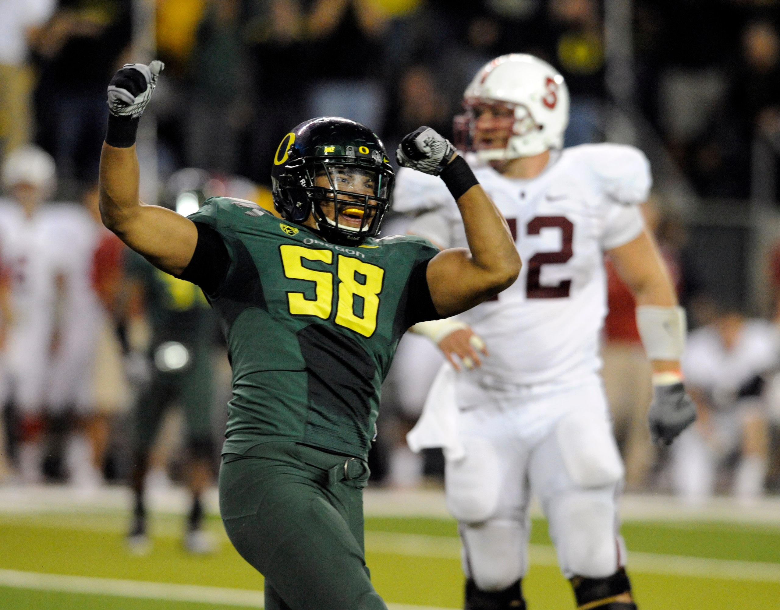 EUGENE, OR - OCTOBER 2: Defensive end Kenny Rowe #58 of the Oregon Ducks celebrates after sacking quarterback Andrew Luck of the Stanford Cardinal in the third quarter of the game at Autzen Stadium on October 2, 2010 in Eugene, Oregon. Oregon won the game