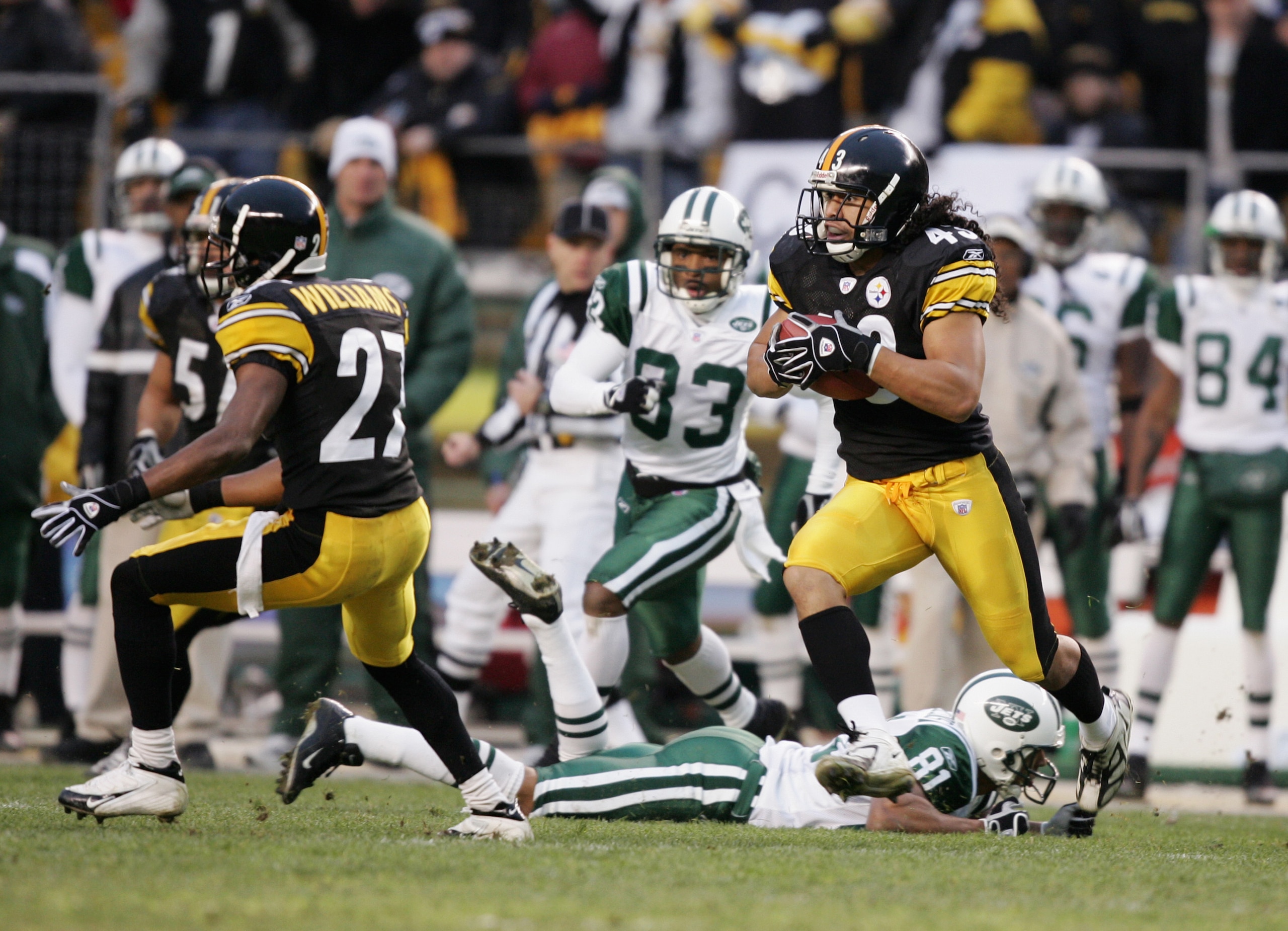 PITTSBURGH - DECEMBER 12:  Strong safety Troy Polamalu #43 of the Pittsburgh Steelers runs with the ball after intercepting a New York Jets pass on December 12, 2004 at Heinz Field in Pittsburgh, Pennsylvania. The Steelers won 17-7. (Photo by Al Bello/Get