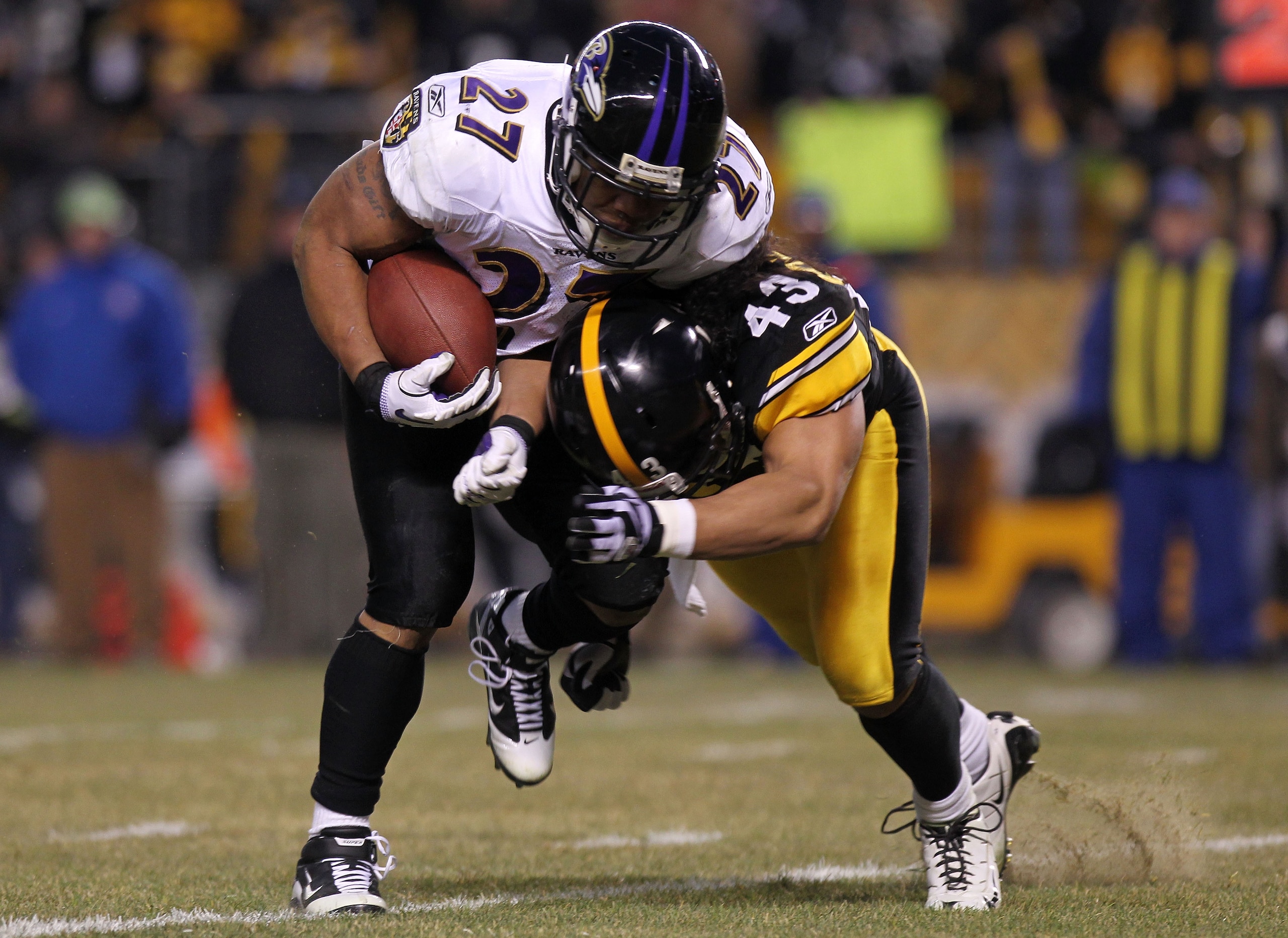 PITTSBURGH, PA - JANUARY 15:  Running back Ray Rice #27 of the Baltimore Ravens is hit by safety Troy Polamalu #43 of the Pittsburgh Steelers in the AFC Divisional Playoff Game at Heinz Field on January 15, 2011 in Pittsburgh, Pennsylvania.  (Photo by Nic