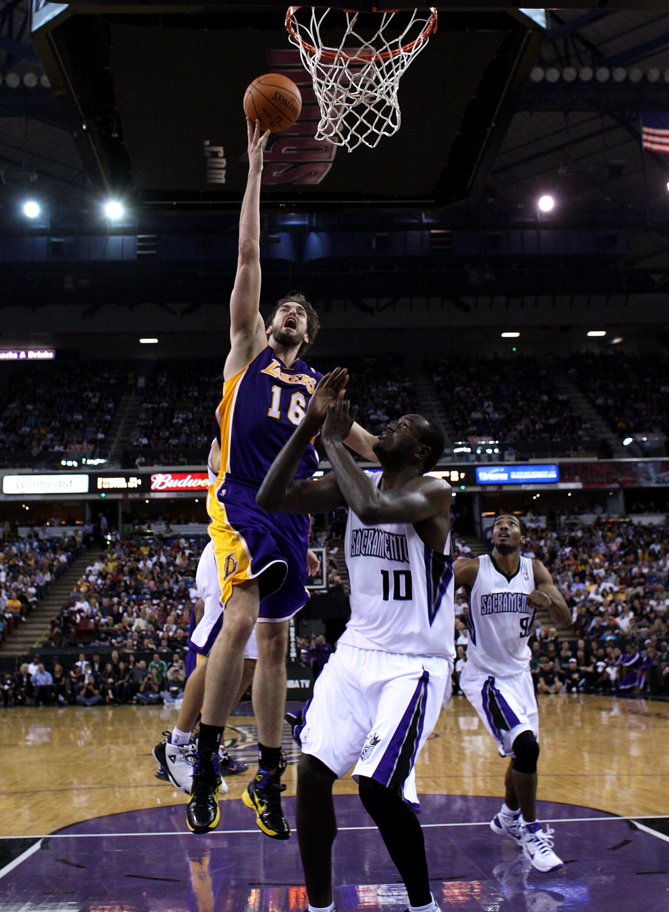 SACRAMENTO, CA - NOVEMBER 03:  Pau Gasol #16 of the Los Angeles Lakers shoots the ball over Samuel Dalembert #10 of the Sacramento Kings at ARCO Arena on November 3, 2010 in Sacramento, California.  NOTE TO USER: User expressly acknowledges and agrees tha