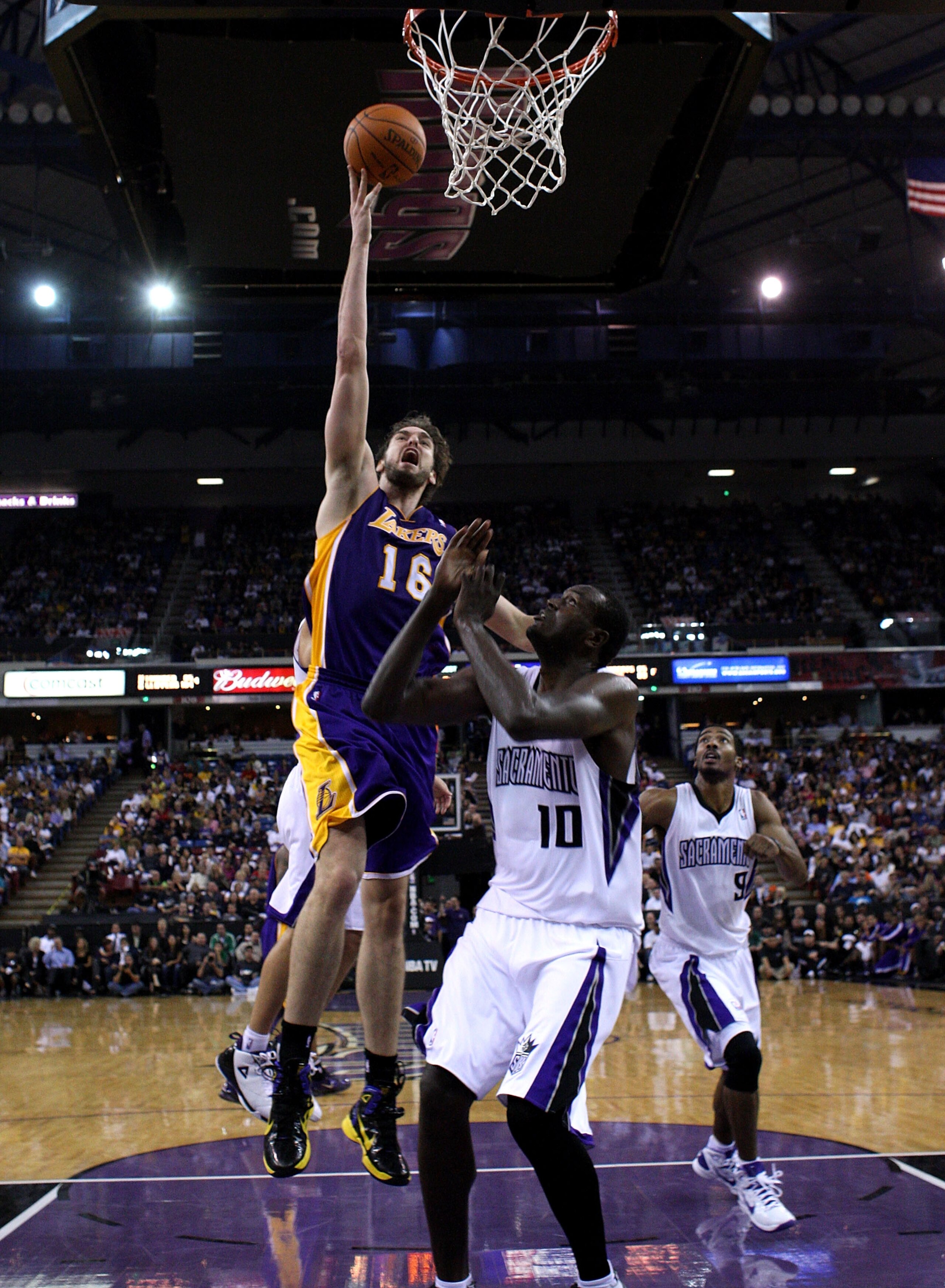 SACRAMENTO, CA - NOVEMBER 03:  Pau Gasol #16 of the Los Angeles Lakers shoots the ball over Samuel Dalembert #10 of the Sacramento Kings at ARCO Arena on November 3, 2010 in Sacramento, California.  NOTE TO USER: User expressly acknowledges and agrees tha