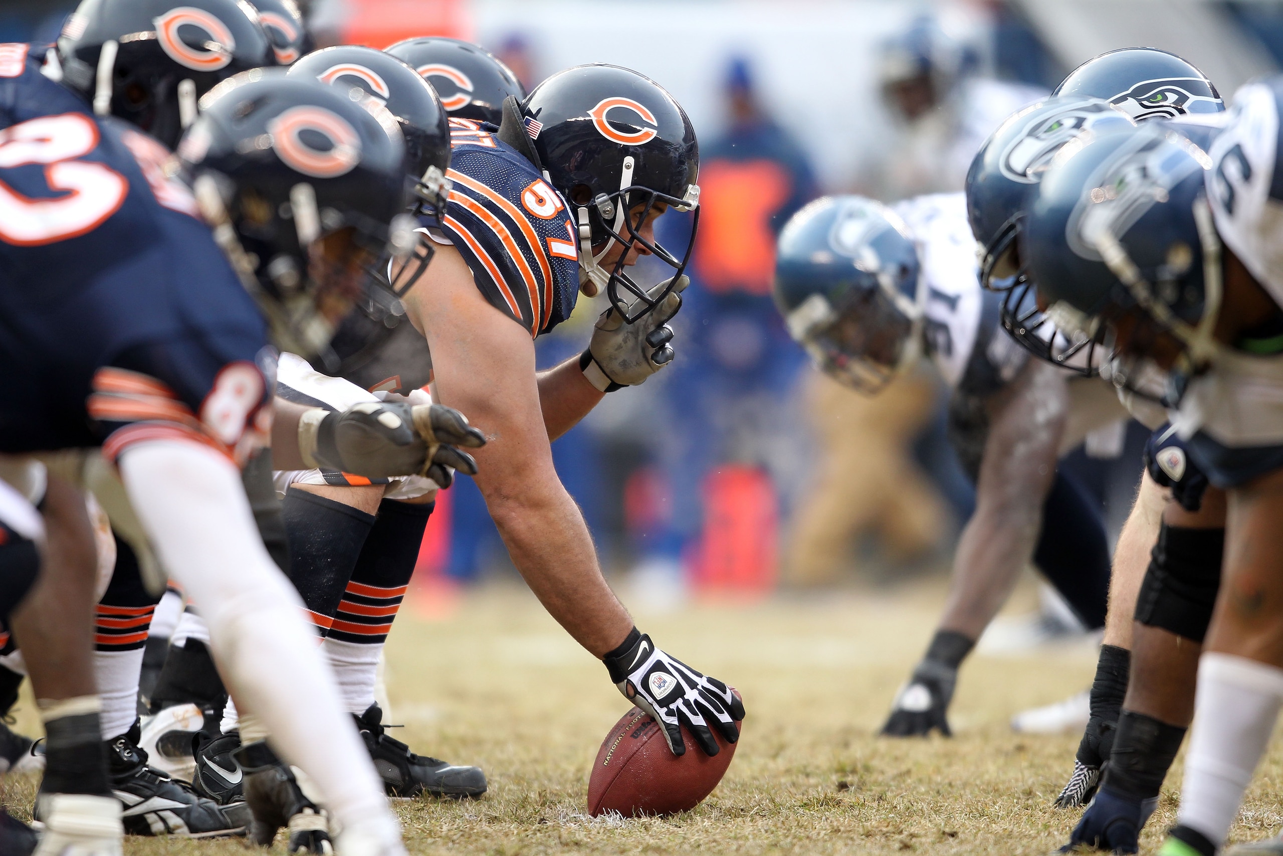 CHICAGO, IL - JANUARY 16:  Center Olin Kreutz #57 of the Chicago Bears prepares to snap the ball against the Seattle Seahawks in the first half in the 2011 NFC divisional playoff game at Soldier Field on January 16, 2011 in Chicago, Illinois.  (Photo by A