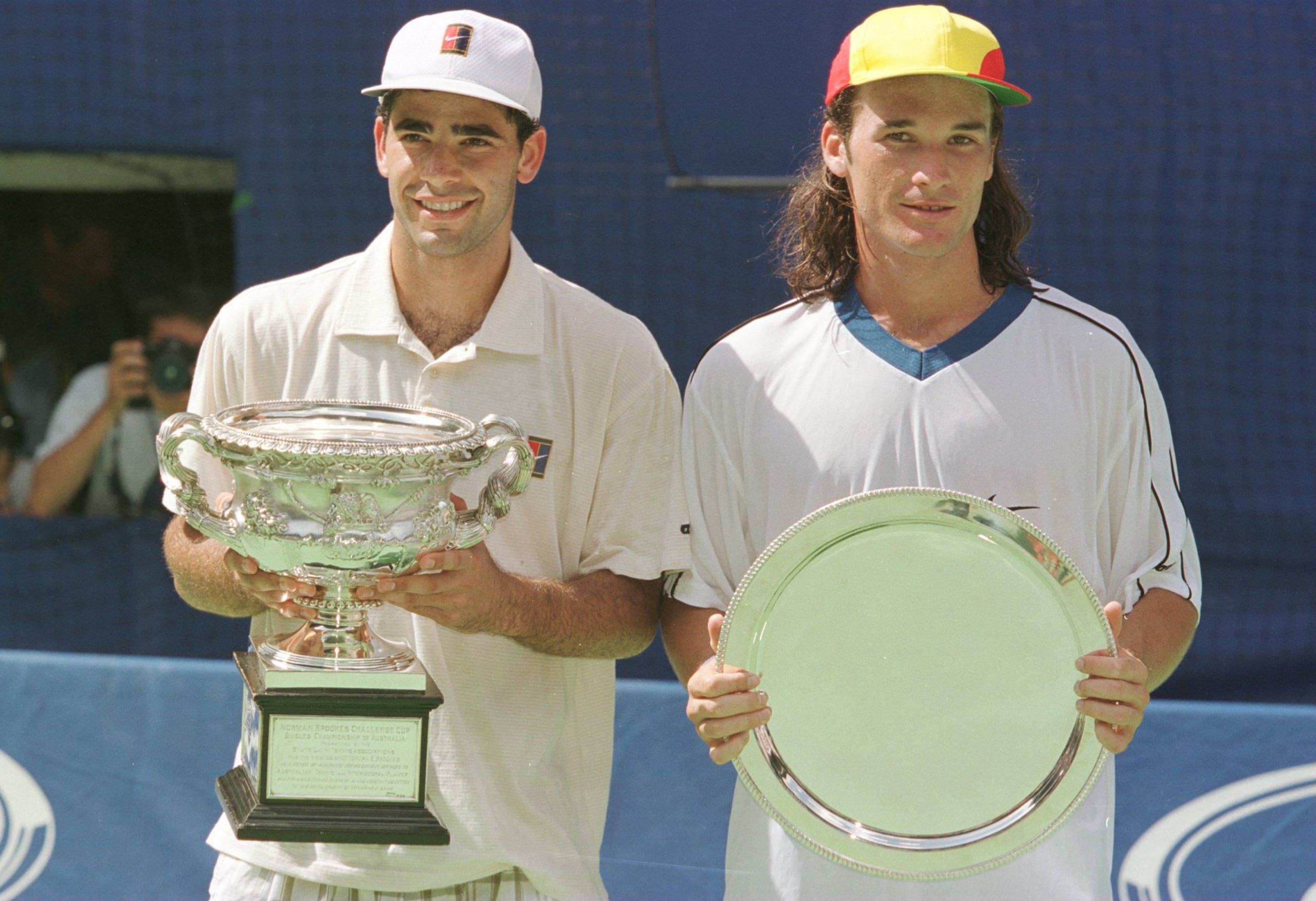 26 Jan 1997:  World number one Pete Sampras of the USA with  Carlos Moya of Spain after Sampras'' win in the mens final match at the Ford Australian Open in Melbourne, Australia. Sampras won the match 6-2, 6-3, 6-3. Mandatory Credit: Clive Mason/ALLSPORT