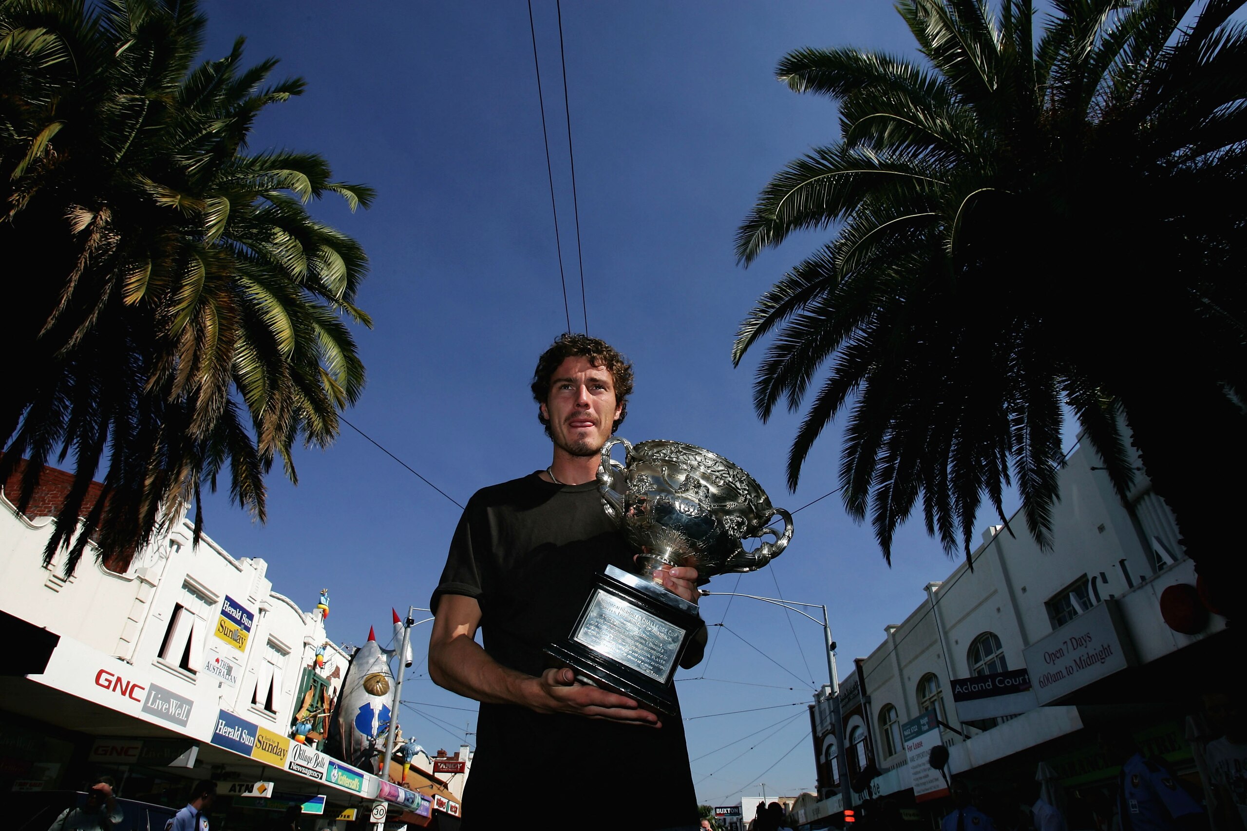 MELBOURNE, AUSTRALIA - JANUARY 31: Marat Safin of Russia poses with the winner's trophy at Acland Street St Kilda during the official photo call the morning after winning the men's Australian Open Grand Slam against Lleyton Hewitt of Australia at Melbourn