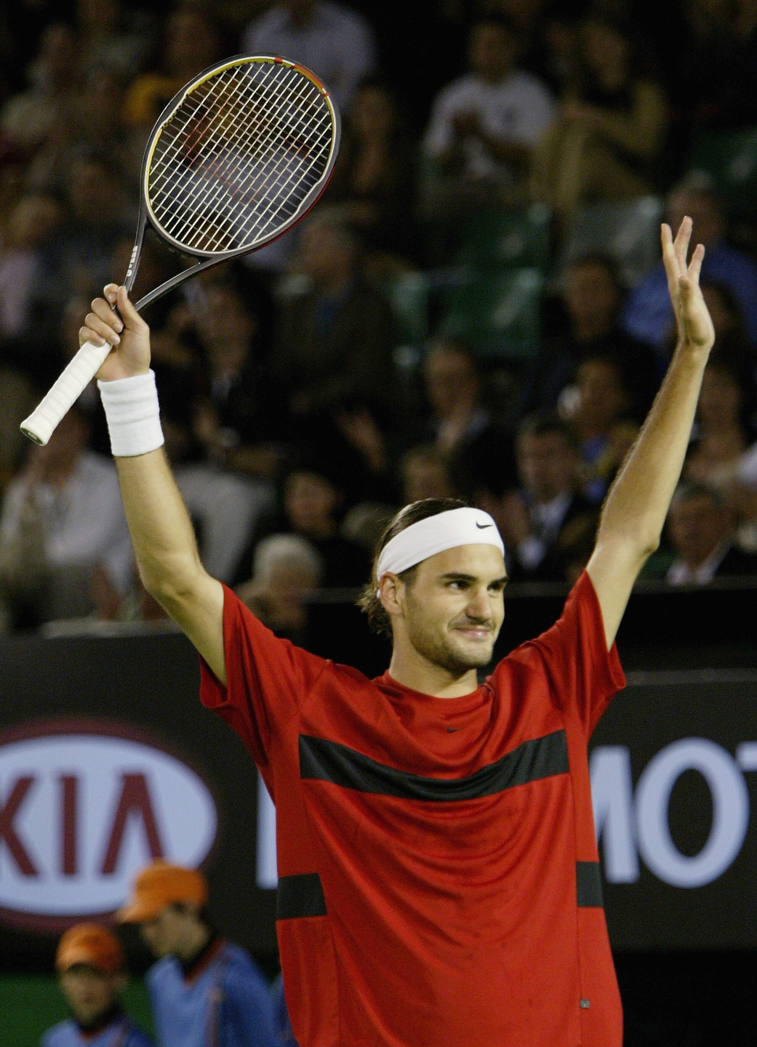 MELBOURNE, AUSTRALIA - JANUARY 30:  Roger Federer of Switzerland celebrates his victory against Juan Carlos Ferrero of Spain during day twelve of the Australian Open Grand Slam at Melbourne Park January 30, 2004 in Melbourne, Australia. (Photo by Clive Br