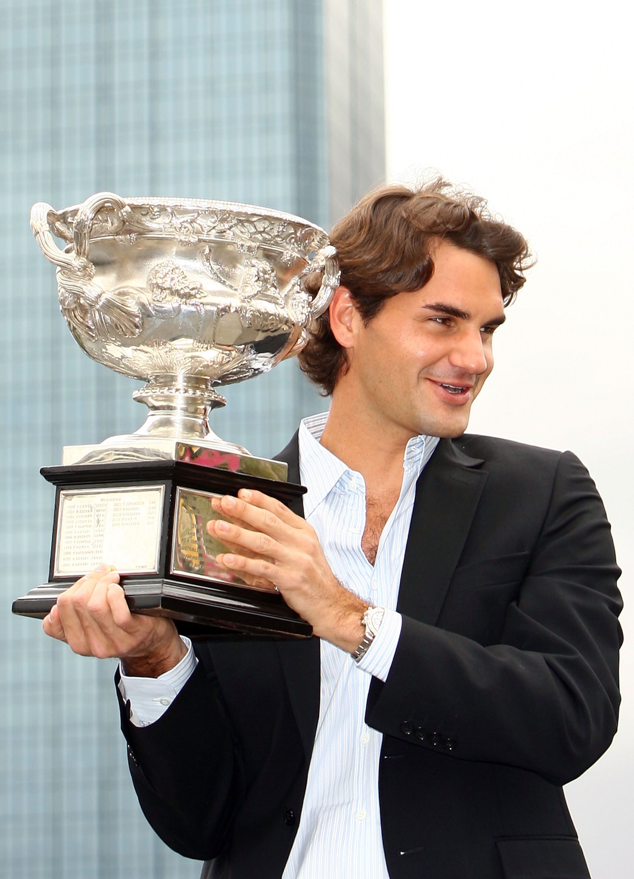 MELBOURNE, AUSTRALIA - JANUARY 29:  Roger Federer poses with the Australian Open 2007 winners trophy at Southbank Boulevard on January 29, 2007 in Melbourne, Australia. Federer defeated Fernando Gonzalez in three sets.   (Photo by Kristian Dowling/Getty I