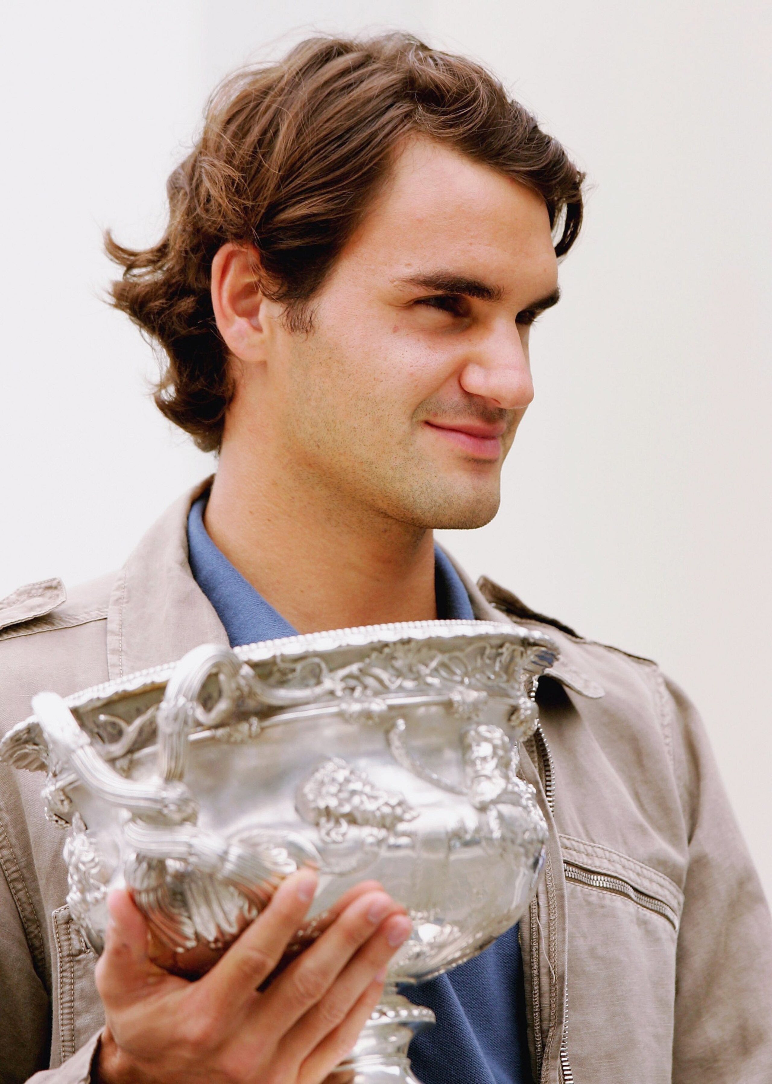 MELBOURNE, AUSTRALIA - JANUARY 30:  Roger Federer of Switzerland displays his winning trophy for the Australian Open Men's Championship during a photocall at the Docklands on January 30, 2006 in Melbourne, Australia.  (Photo by Mark Dadswell/Getty Images)
