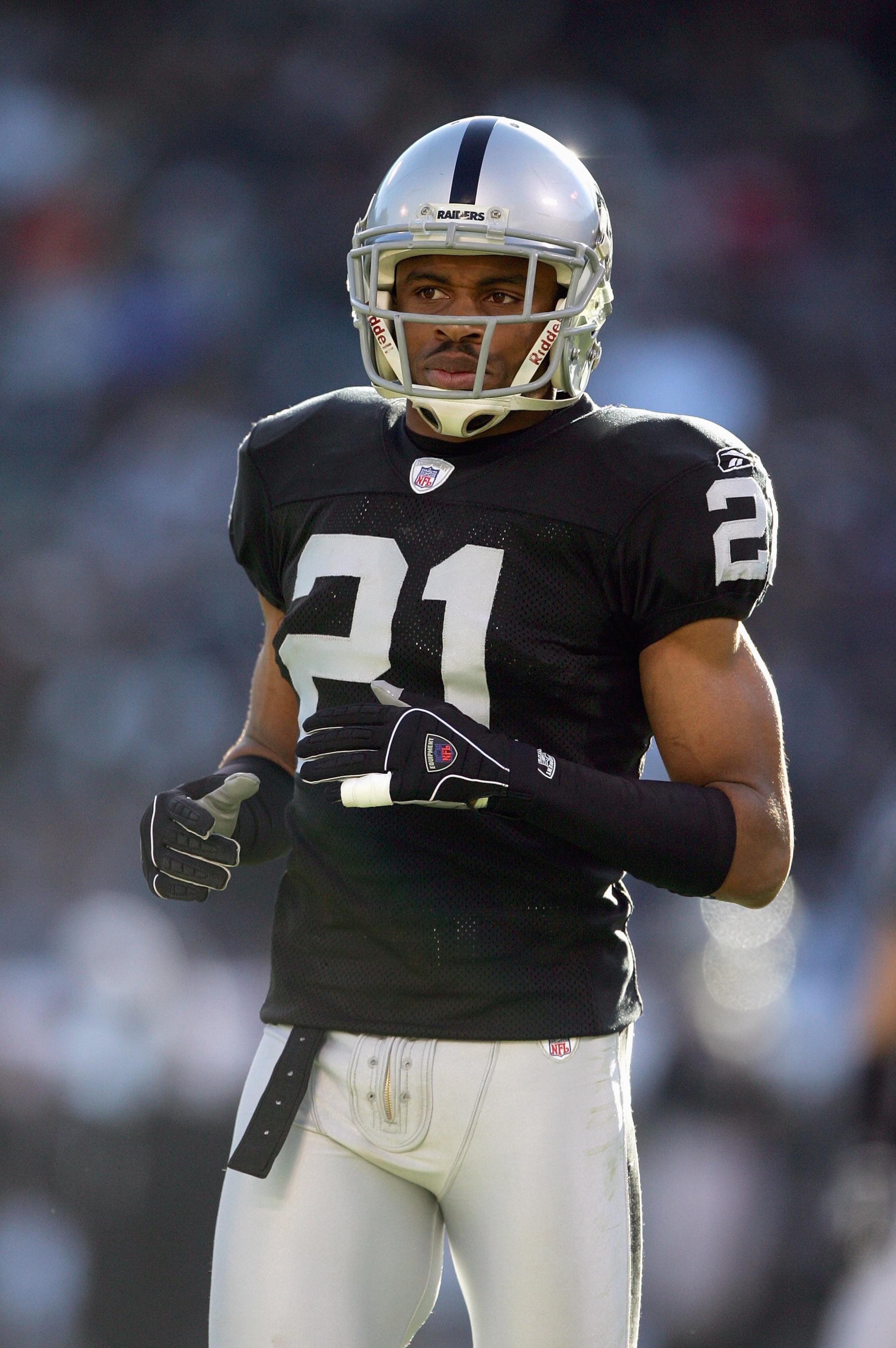 OAKLAND, CA - DECEMBER 17: Nnamdi Asomugha #21 of the Oakland Raiders jogs on the field during an NFL game against the St. Louis Rams at McAfee Coliseum December 17, 2006 in Oakland, California. (Photo by Jed Jacobsohn/Getty Images)