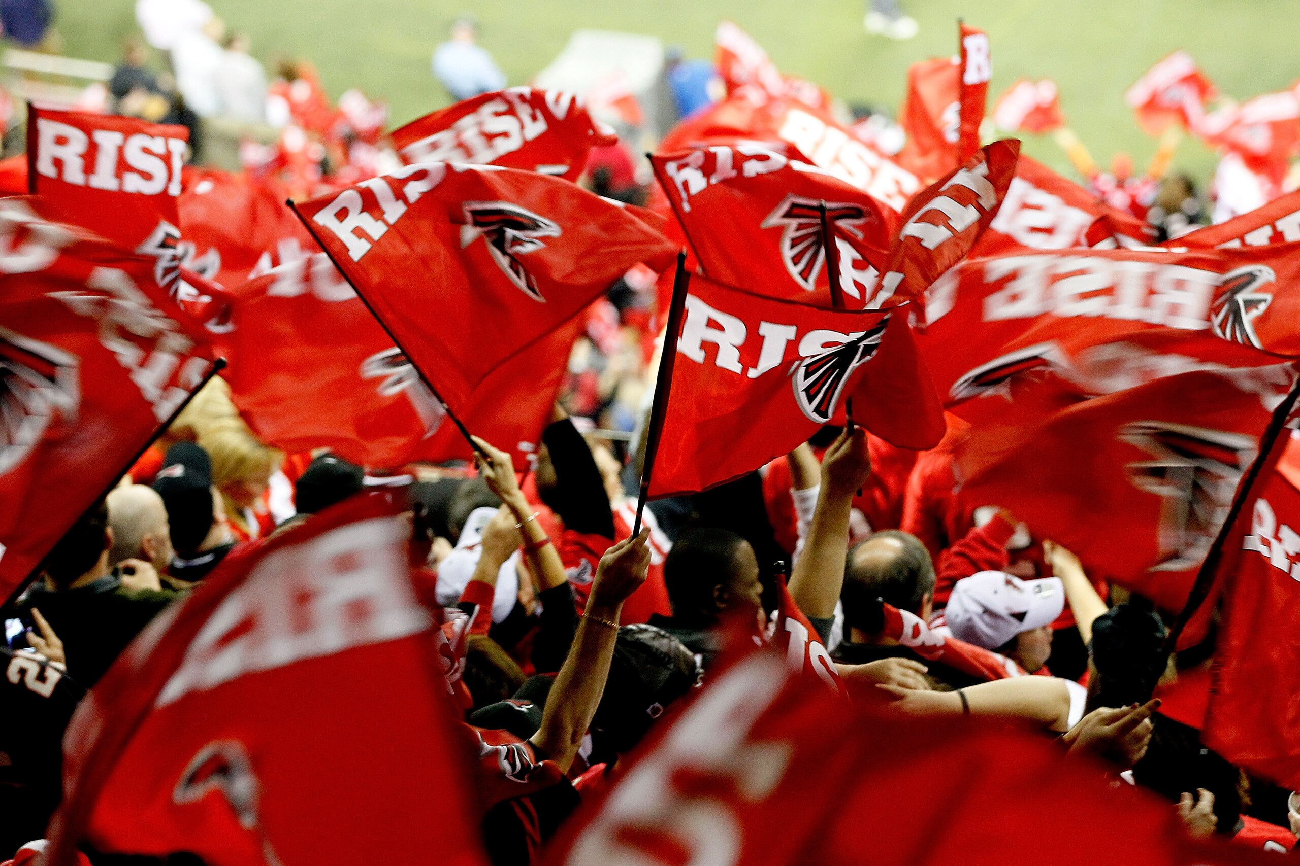 ATLANTA, GA - JANUARY 15:  Fans of the Atlanta Falcons wave flags which read 'Rise Up' against the Green Bay Packers during their 2011 NFC divisional playoff game at Georgia Dome on January 15, 2011 in Atlanta, Georgia.  (Photo by Kevin C. Cox/Getty Image