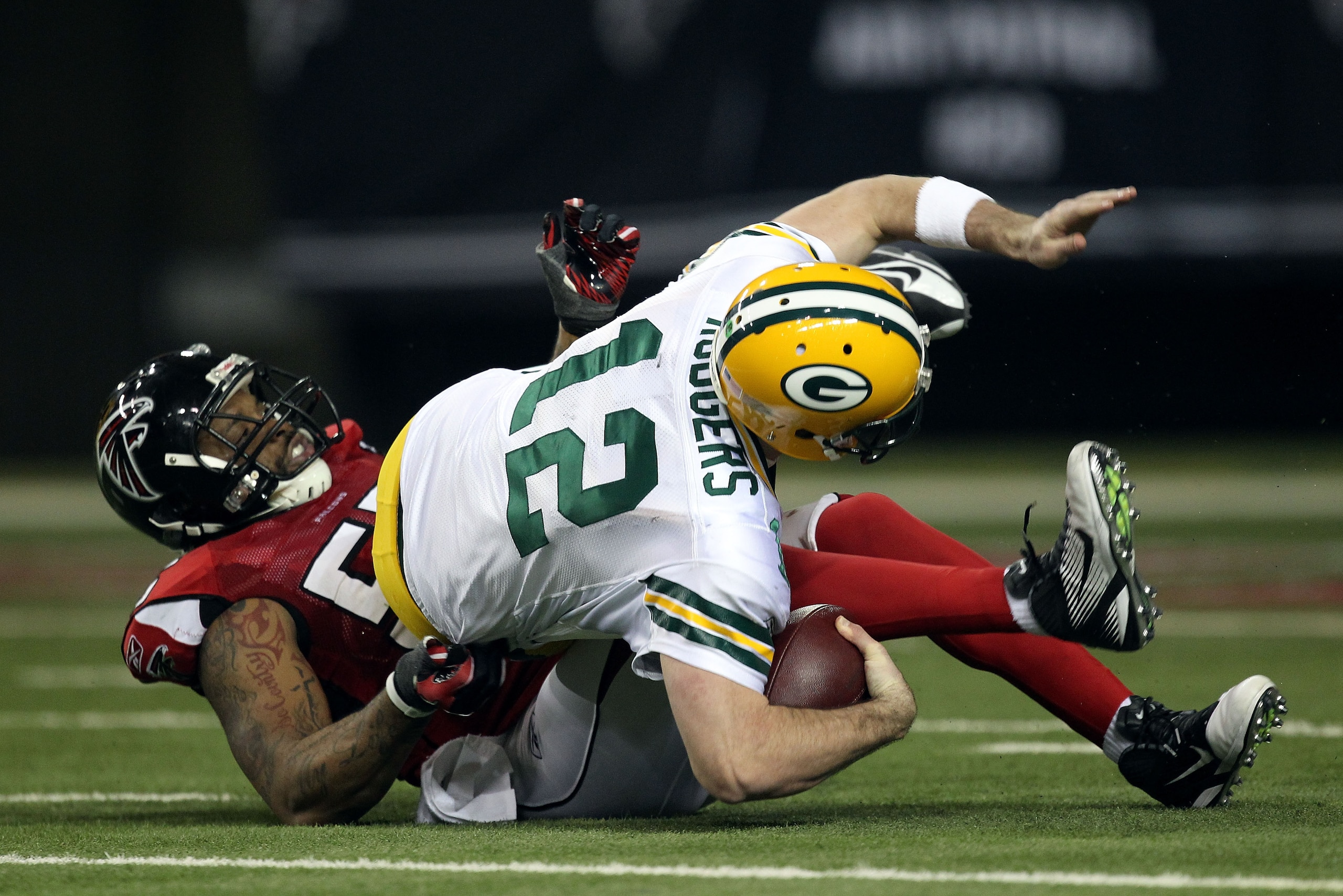 ATLANTA, GA - JANUARY 15:  John Abraham #55 of the Atlanta Falcons sacks Aaron Rodgers #12 of the Green Bay Packers during their 2011 NFC divisional playoff game at Georgia Dome on January 15, 2011 in Atlanta, Georgia.  (Photo by Streeter Lecka/Getty Imag
