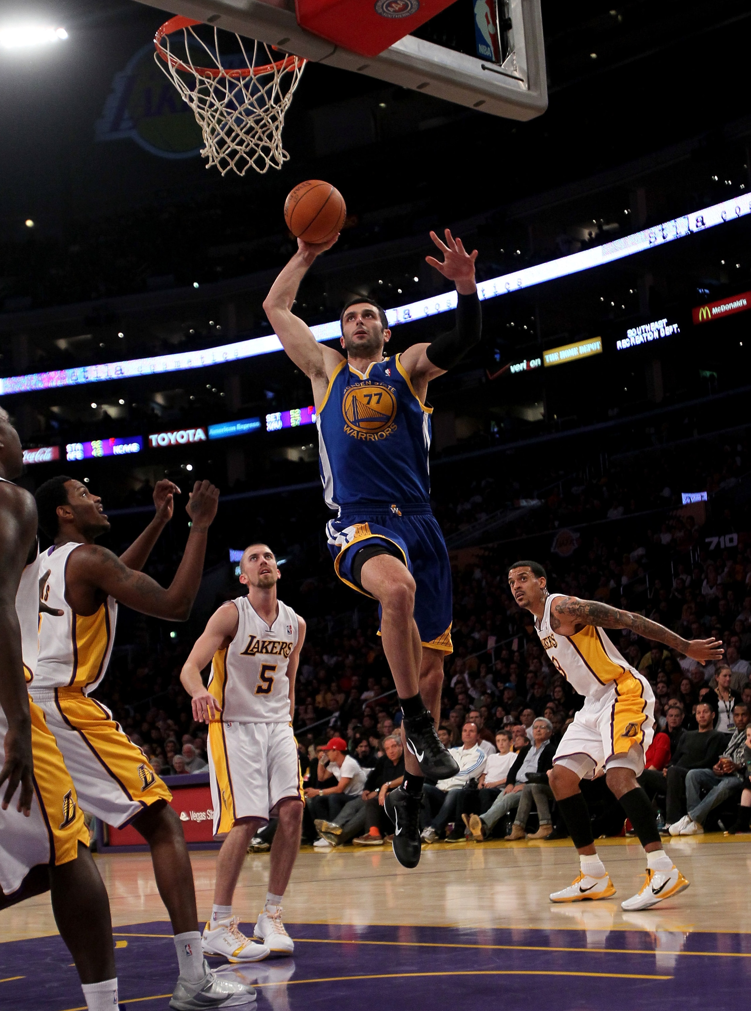 LOS ANGELES - NOVEMBER 21:  Vladimir Radmanovic #77 of the Golden State Warriors goes up for a dunk against the Los Angeles Lakers at Staples Center on November 21, 2010 in Los Angeles, California.   The Lakers won 117-89. NOTE TO USER: User expressly ack