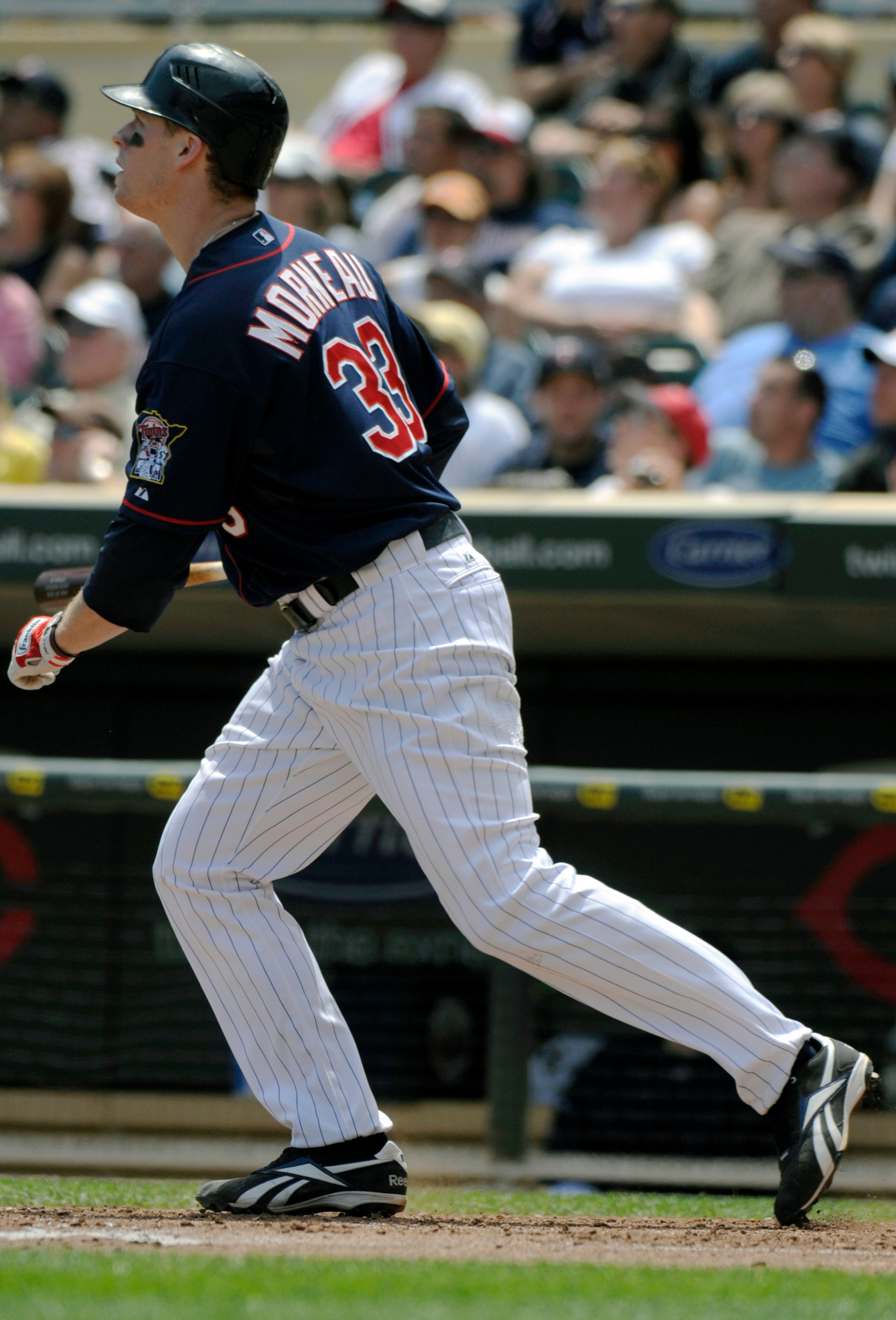 MINNEAPOLIS, MN - JUNE 30: Justin Morneau #33 of the Minnesota Twins watches the flight of his solo home run in the sixth inning against the Detroit Tigers during their game on June 30, 2010 at Target Field in Minneapolis, Minnesota. (Photo by Hannah Fosl MINNEAPOLIS, MN - JUNE 30: Justin Morneau #33 of the Minnesota Twins watches the flight of his solo home run in the sixth inning against the Detroit Tigers during their game on June 30, 2010 at Target Field in Minneapolis, Minnesota. (Photo by Hannah Fosl