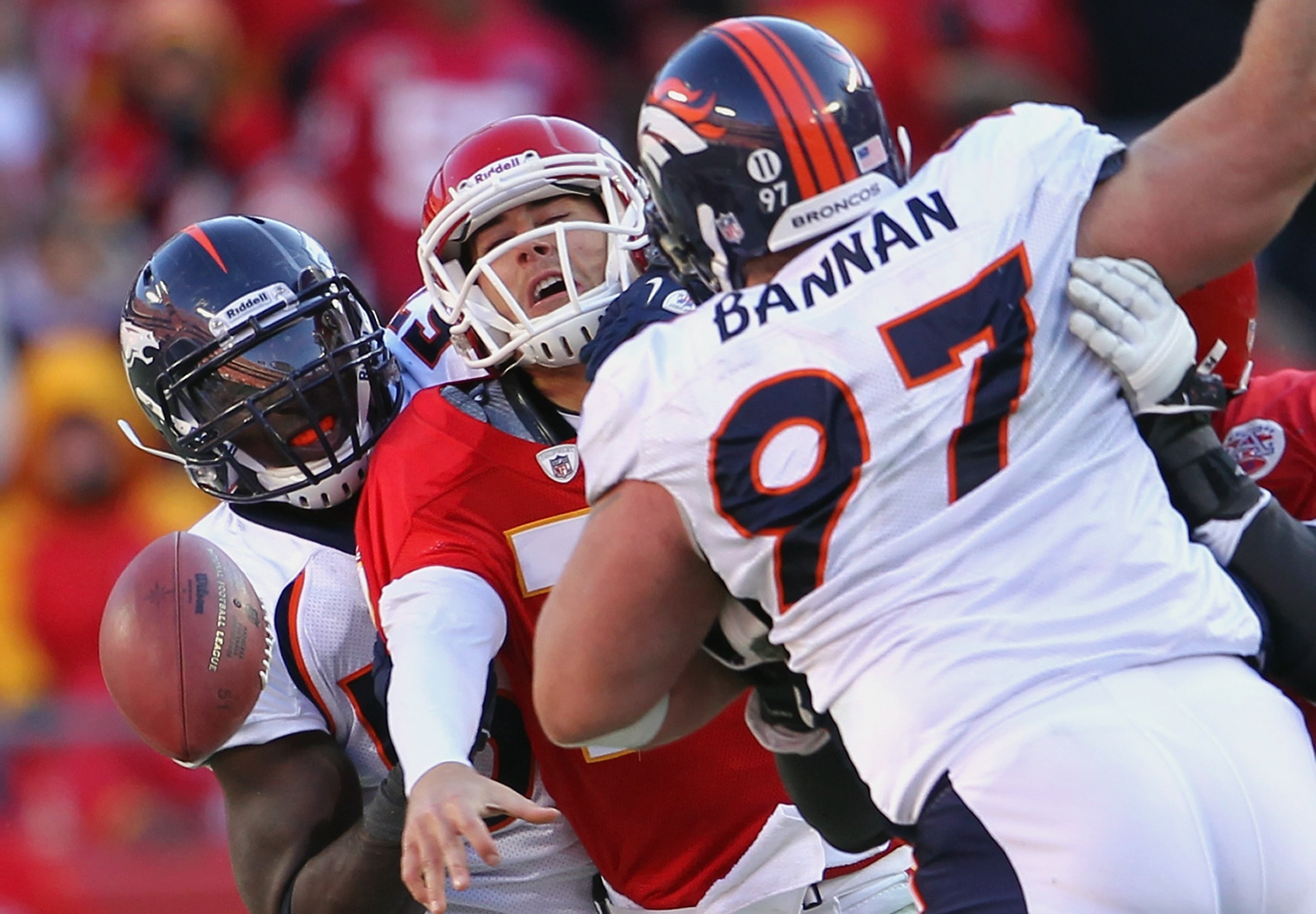KANSAS CITY, MO - DECEMBER 05:  Quarterback Matt Cassel #7 of the Kansas City Chiefs loses the ball as he is pressured by Mario Haggan #57 and Justin Bannan #97 of the Denver Broncos during the game on December 5, 2010 at Arrowhead Stadium in Kansas City,