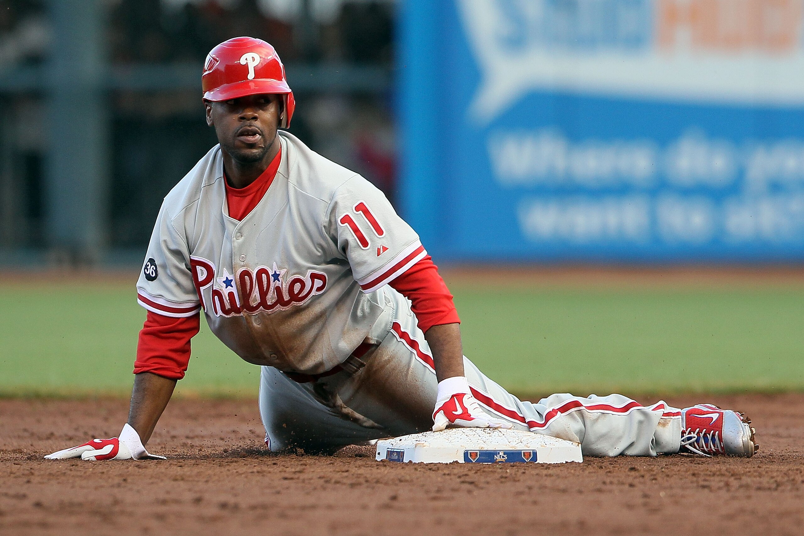 SAN FRANCISCO - OCTOBER 20: Jimmy Rollins #11 of the Philadelphia Phillies slides in to second base after being tagged out in the second inning during Game Four of the NLCS against the San Francisco Giants in the 2010 MLB Playoffs at AT&T Park on October SAN FRANCISCO - OCTOBER 20: Jimmy Rollins #11 of the Philadelphia Phillies slides in to second base after being tagged out in the second inning during Game Four of the NLCS against the San Francisco Giants in the 2010 MLB Playoffs at AT&T Park on October
