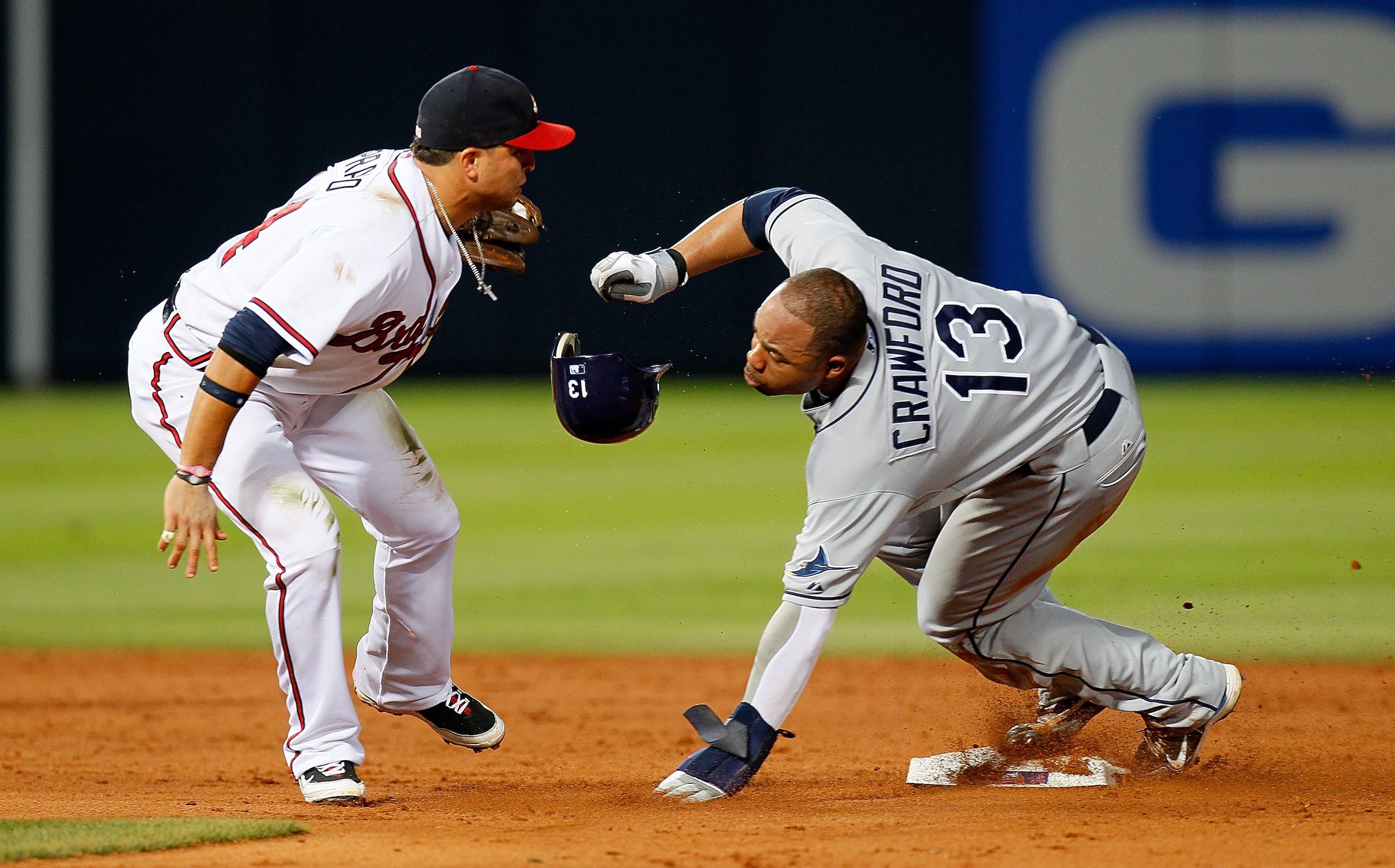ATLANTA - JUNE 17: Martin Prado #14 of the Atlanta Braves tags out a sliding Carl Crawford #13 of the Tampa Bay Rays at second base at Turner Field on June 17, 2010 in Atlanta, Georgia. (Photo by Kevin C. Cox/Getty Images) ATLANTA - JUNE 17: Martin Prado #14 of the Atlanta Braves tags out a sliding Carl Crawford #13 of the Tampa Bay Rays at second base at Turner Field on June 17, 2010 in Atlanta, Georgia. (Photo by Kevin C. Cox/Getty Images)