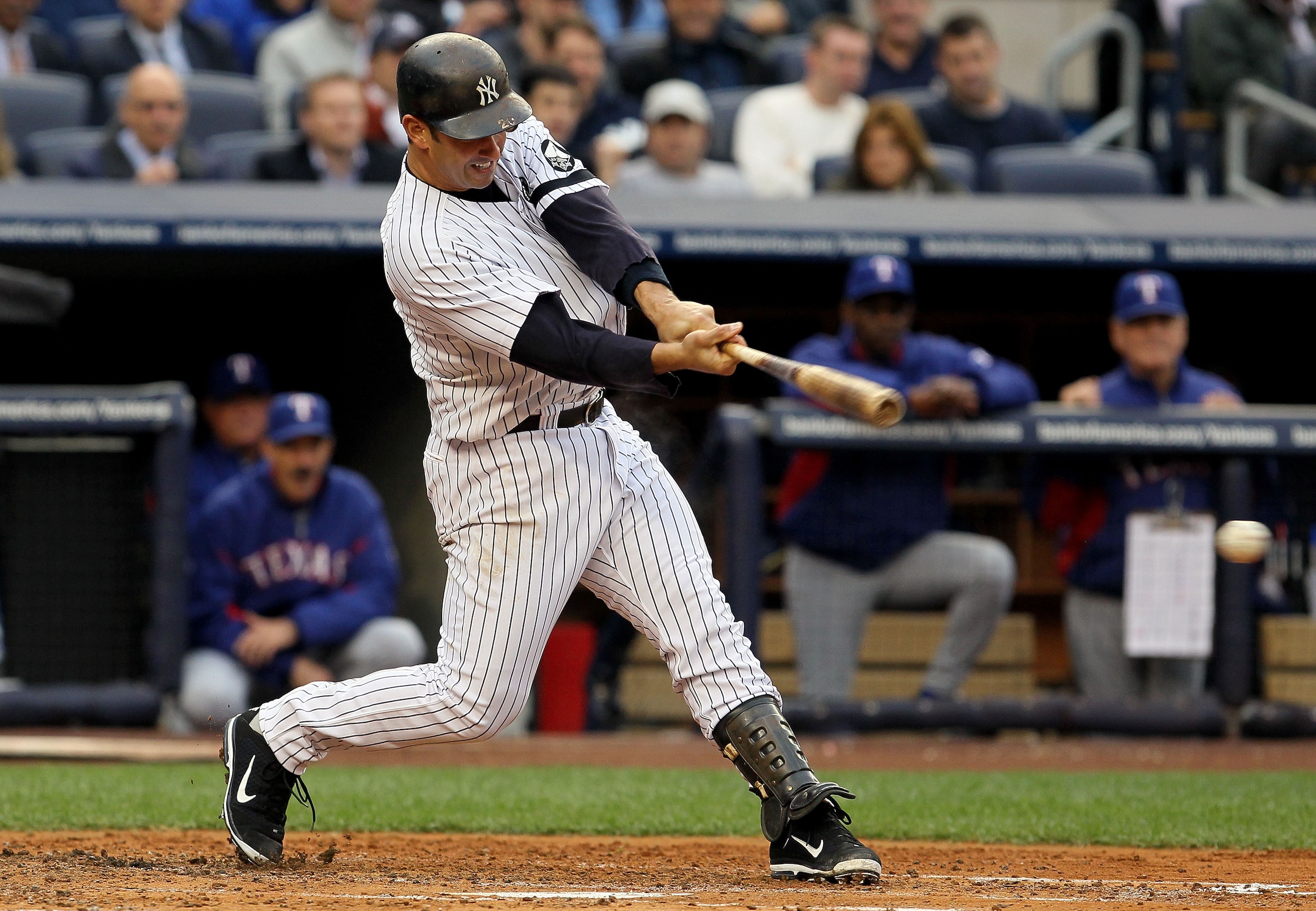 NEW YORK - OCTOBER 20: Jorge Posada #20 of the New York Yankees hits a RBI single in the bottom of the second inning against the Texas Rangers in Game Five of the ALCS during the 2010 MLB Playoffs at Yankee Stadium on October 20, 2010 in the Bronx boroug NEW YORK - OCTOBER 20: Jorge Posada #20 of the New York Yankees hits a RBI single in the bottom of the second inning against the Texas Rangers in Game Five of the ALCS during the 2010 MLB Playoffs at Yankee Stadium on October 20, 2010 in the Bronx boroug