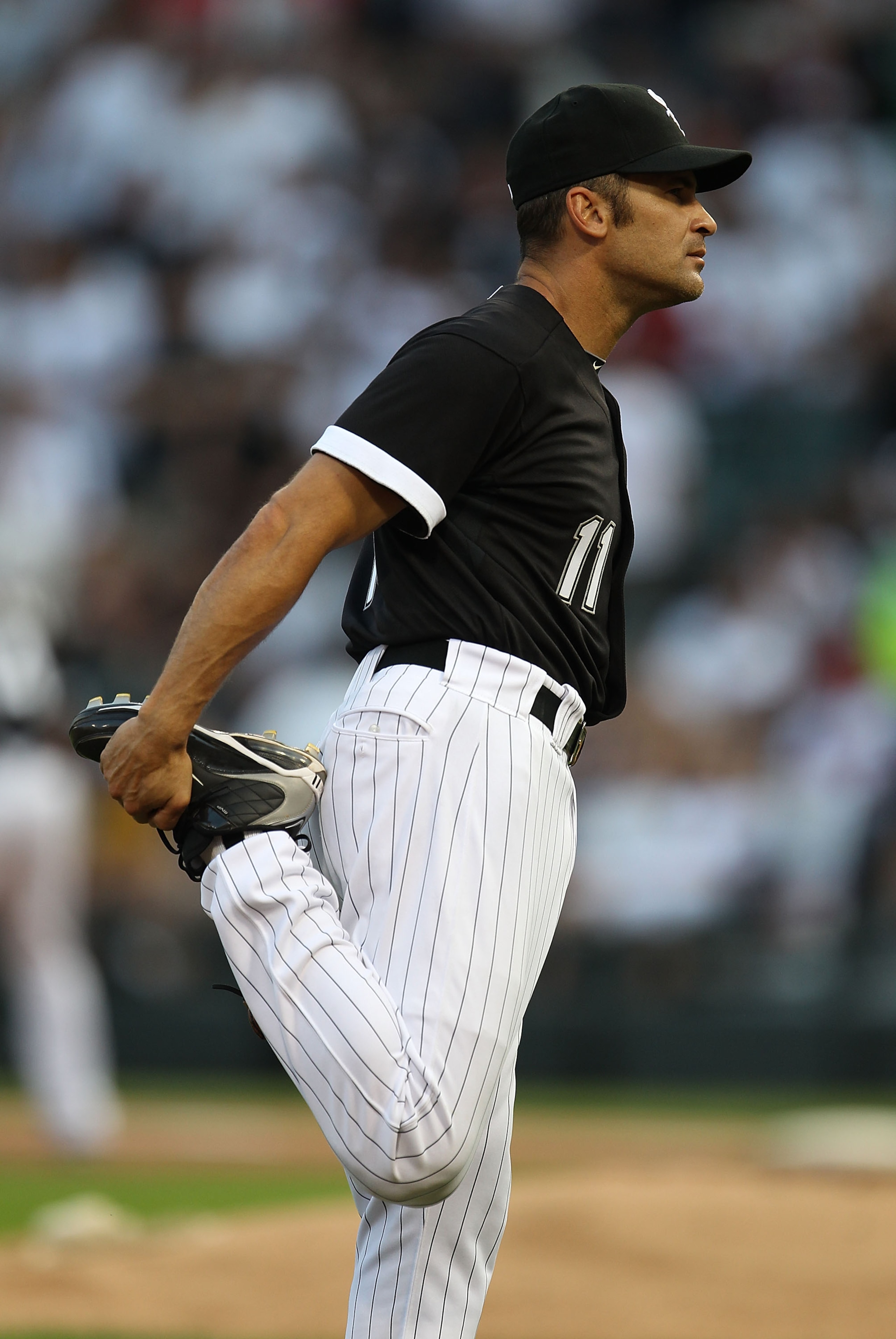CHICAGO - AUGUST 10: Omar Vizquel #11 of the Chicago White Sox stretches before the start of a game against the Minnesota Twins at U.S. Cellular Field on August 10, 2010 in Chicago, Illinois. The Twins defeated the White Sox 12-6. (Photo by Jonathan Danie CHICAGO - AUGUST 10: Omar Vizquel #11 of the Chicago White Sox stretches before the start of a game against the Minnesota Twins at U.S. Cellular Field on August 10, 2010 in Chicago, Illinois. The Twins defeated the White Sox 12-6. (Photo by Jonathan Danie