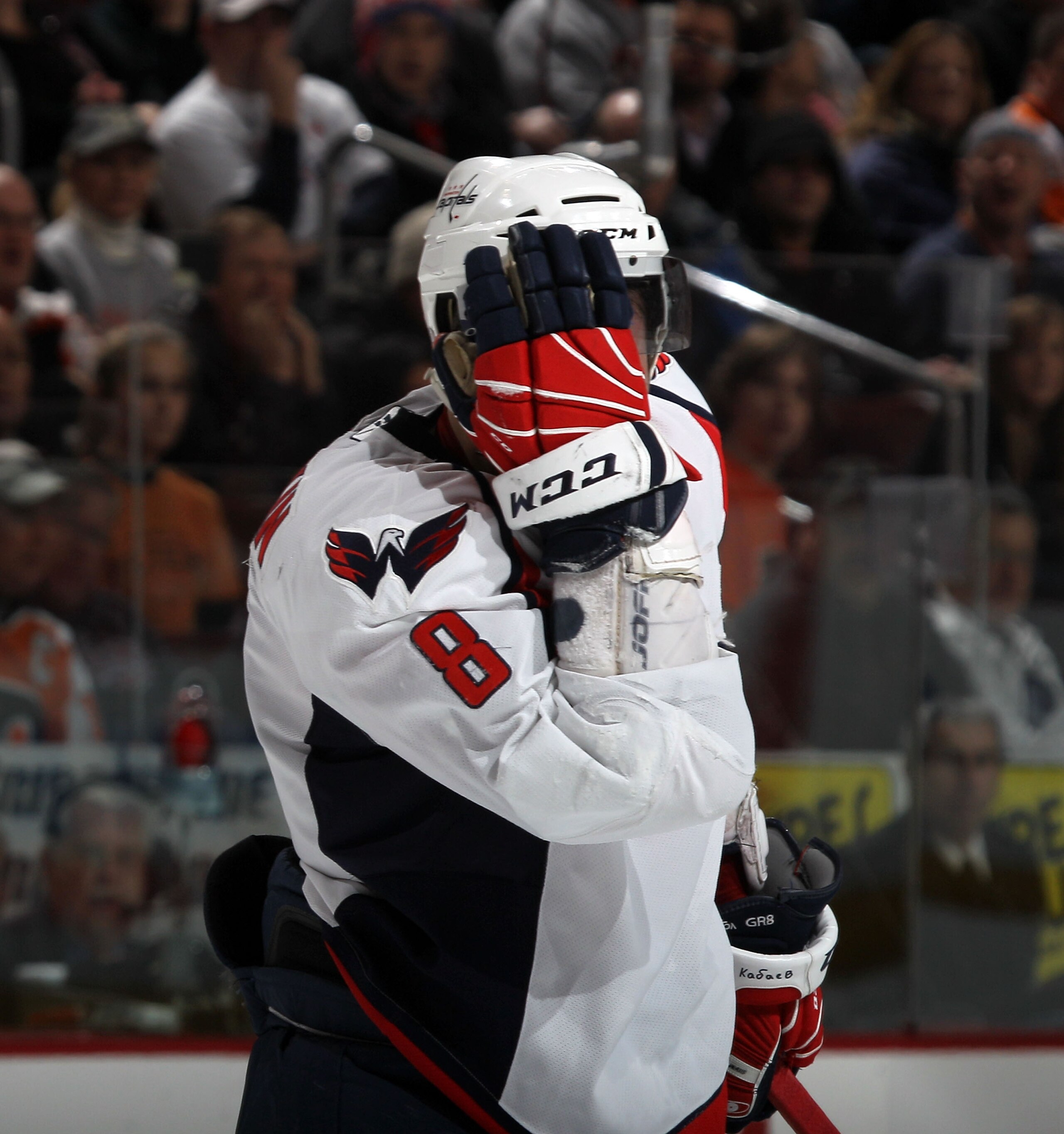 PHILADELPHIA, PA - JANUARY 18: Alex Ovechkin #8 of the Washington Capitals reacts after being hit in the head during the game against the Philadelphia Flyers at the Wells Fargo Center on January 18, 2011 in Philadelphia, Pennsylvania. (Photo by Bruce Benn