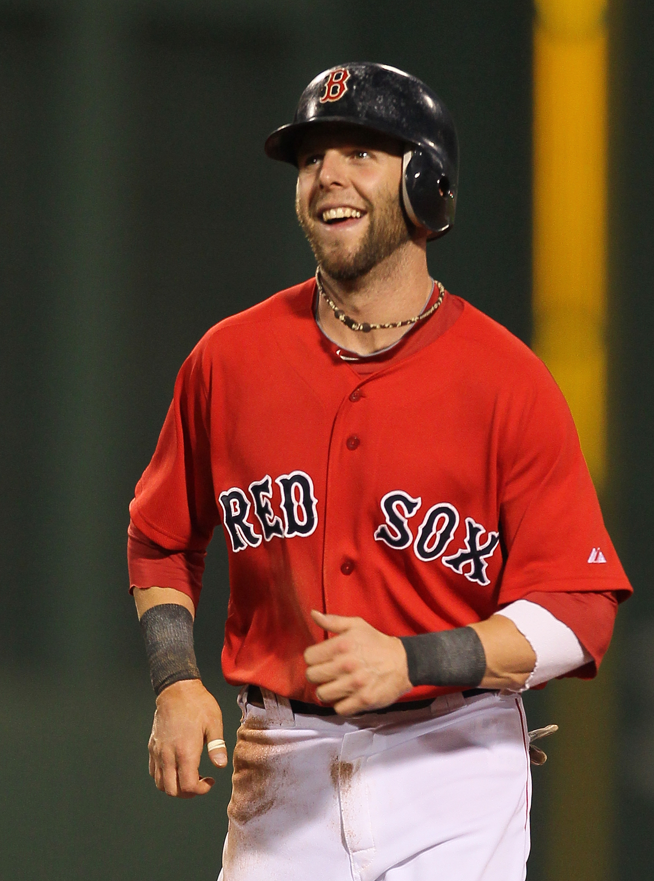 Dustin Pedroia of the Boston Red Sox with his son during the 2010