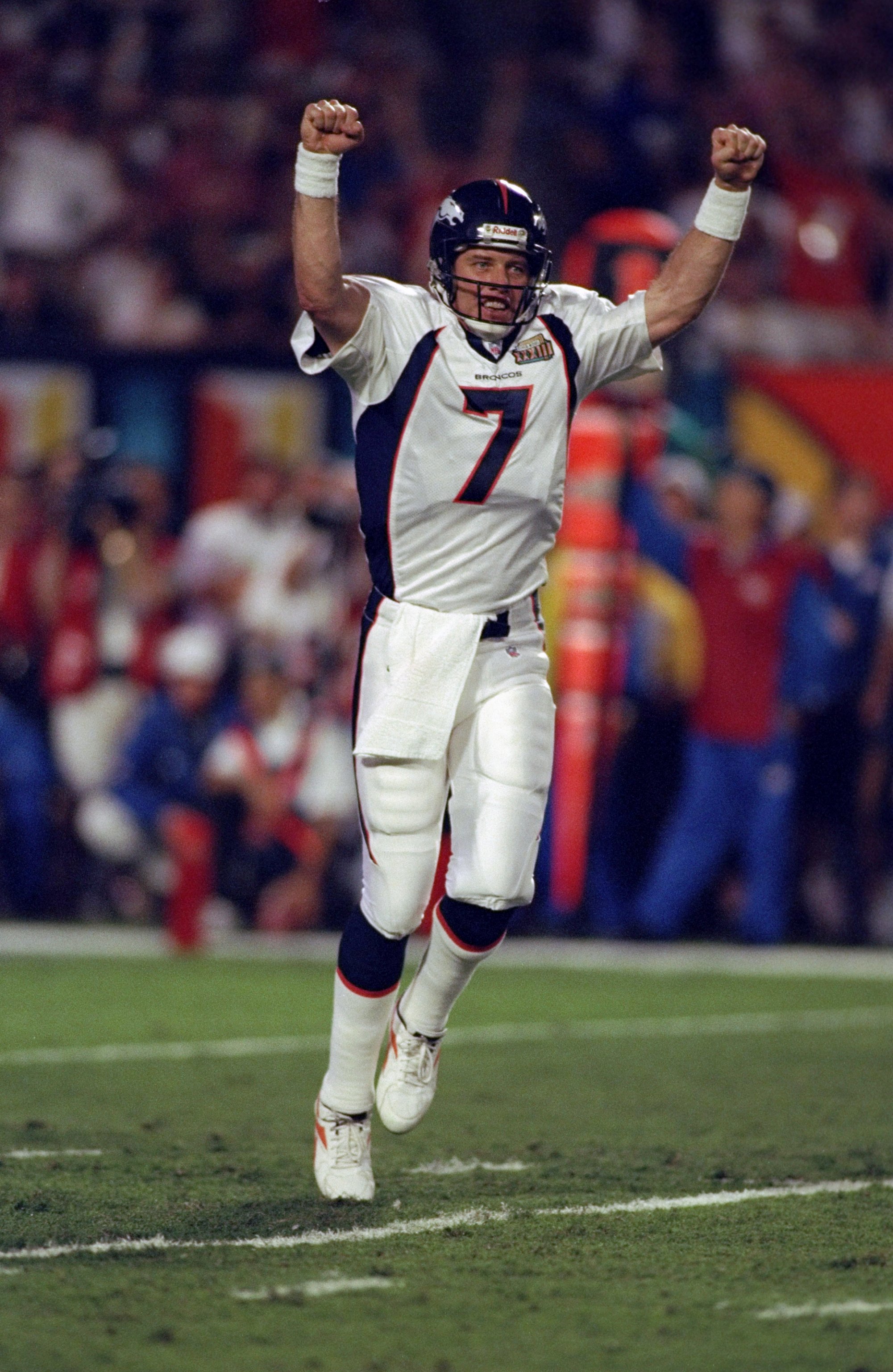 31 Jan 1999: Quarterback John Elway #7 of the Denver Broncos celebrates the first touchdown during the first quarter of Super Bowl XXXIII against the Atlanta Falcons at Pro Player Stadium in Miami, Florida. The Broncos defeated the Falcons 34-19 to win th