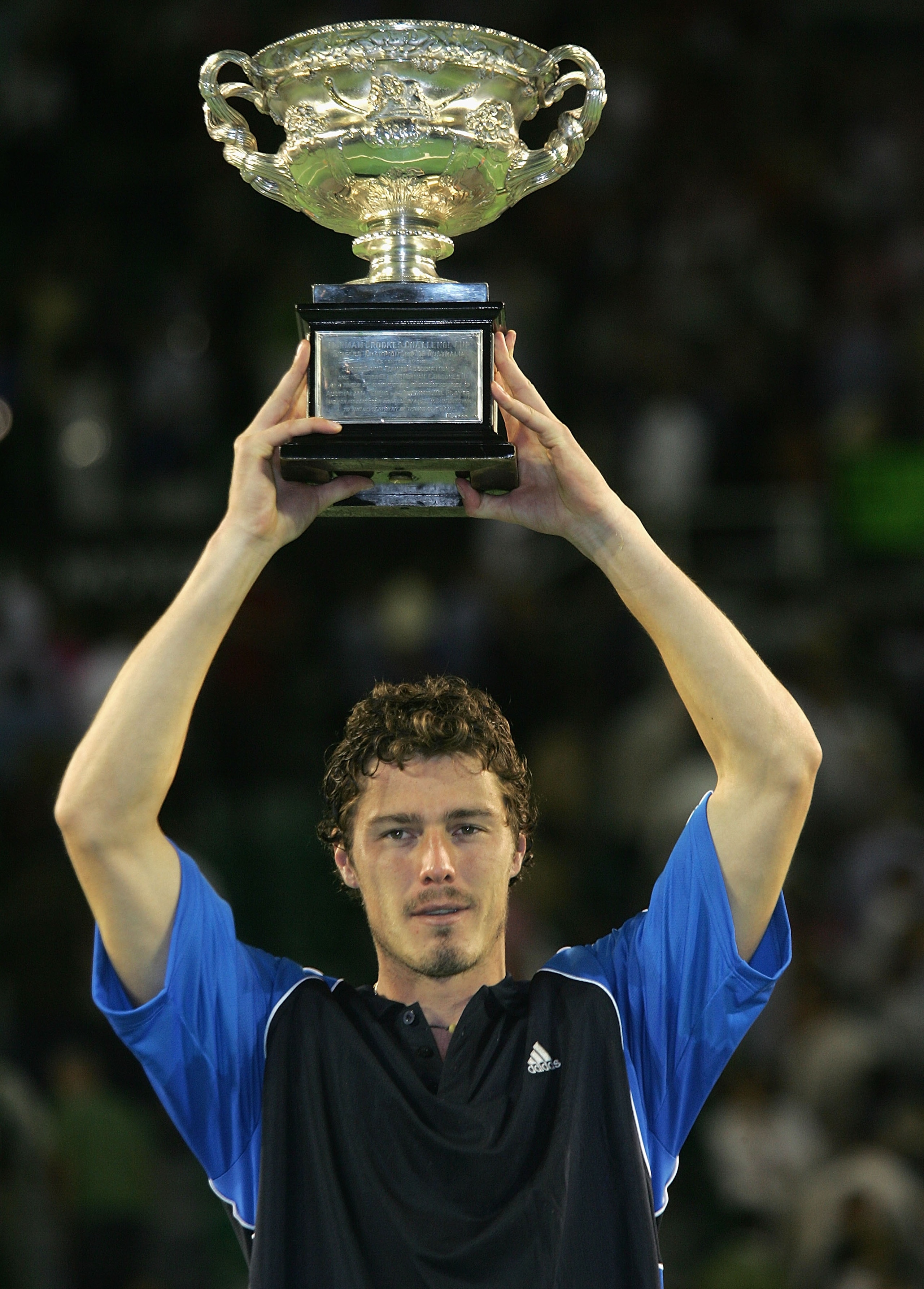 MELBOURNE, AUSTRALIA - JANUARY 30:  Marat Safin of Russia holds up the trophy after defeating Lleyton Hewitt of Australia during the Men's Final during day fourteen of the Australian Open Grand Slam at Melbourne Park January 30, 2005 in Melbourne, Austral