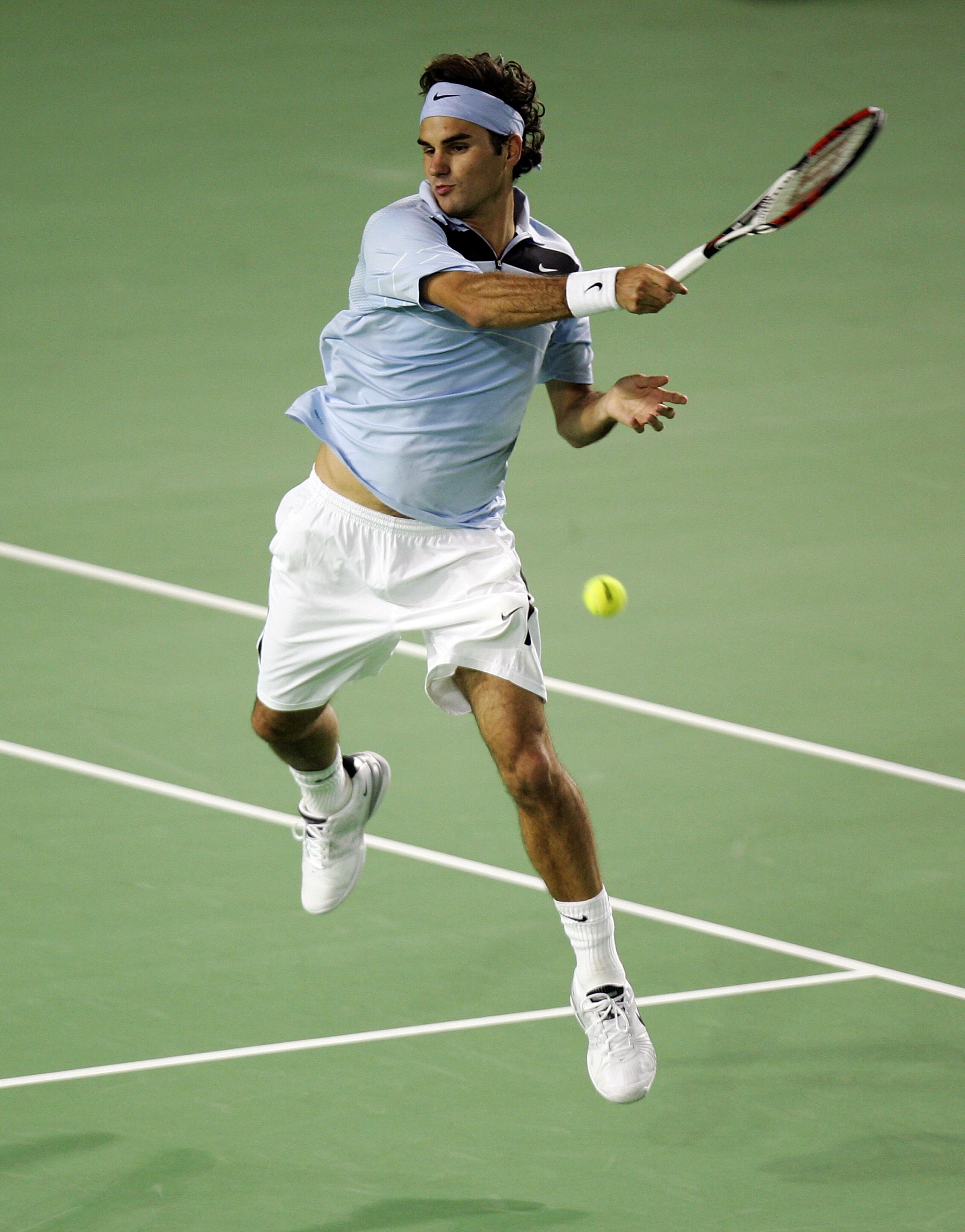 MELBOURNE, AUSTRALIA - JANUARY 28:  Roger Federer of Switzerland plays a forehand during his men's final match against Fernando Gonzalez of Chile on day fourteen of the Australian Open 2007 at Melbourne Park on January 28, 2007 in Melbourne, Australia.  (