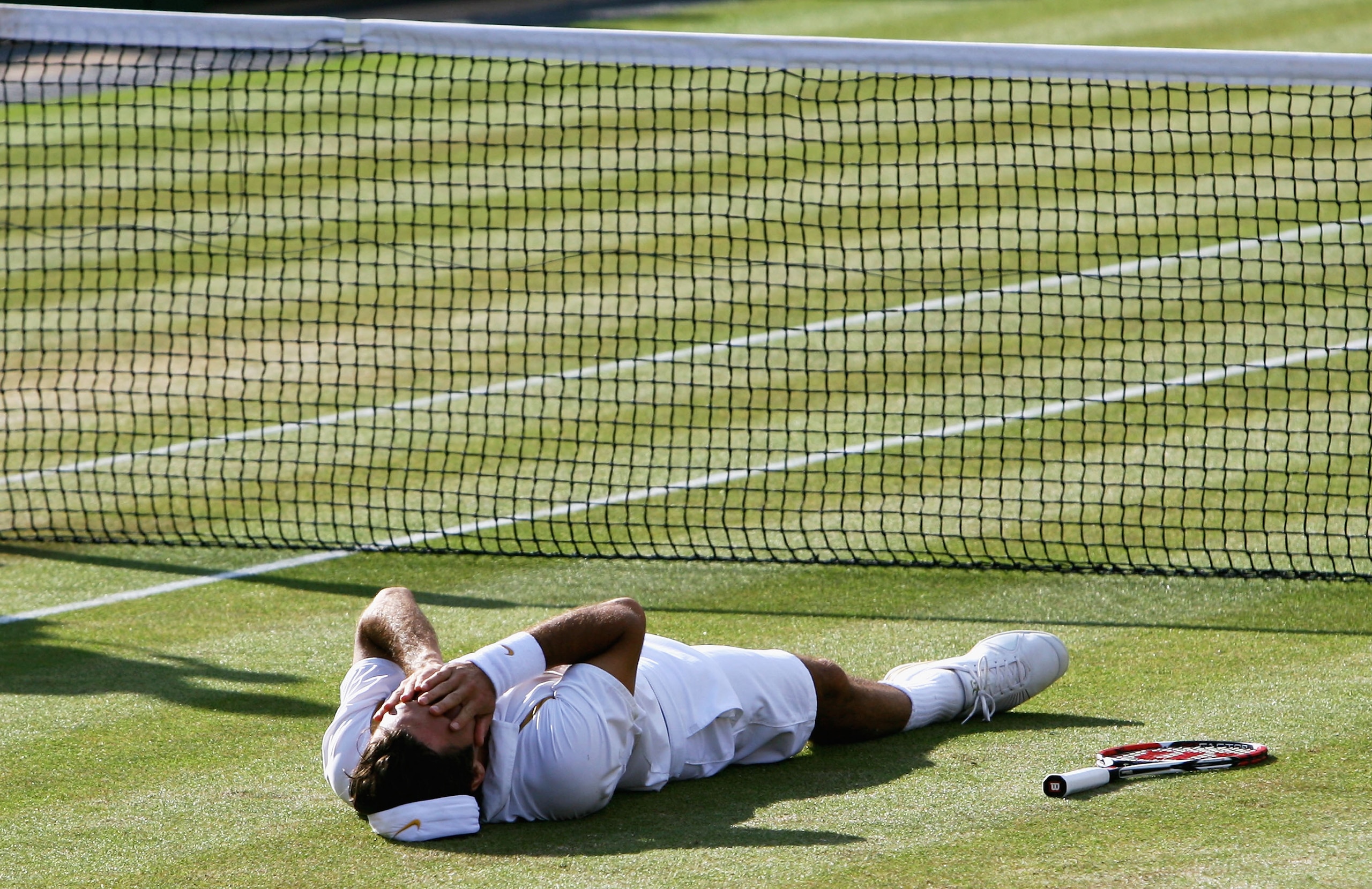 LONDON - JULY 08:  Roger Federer of Switzerland shows his emotions as he celebrates victory following the Men's Singles final match against Rafael Nadal of Spain during day thirteen of the Wimbledon Lawn Tennis Championships at the All England Lawn Tennis