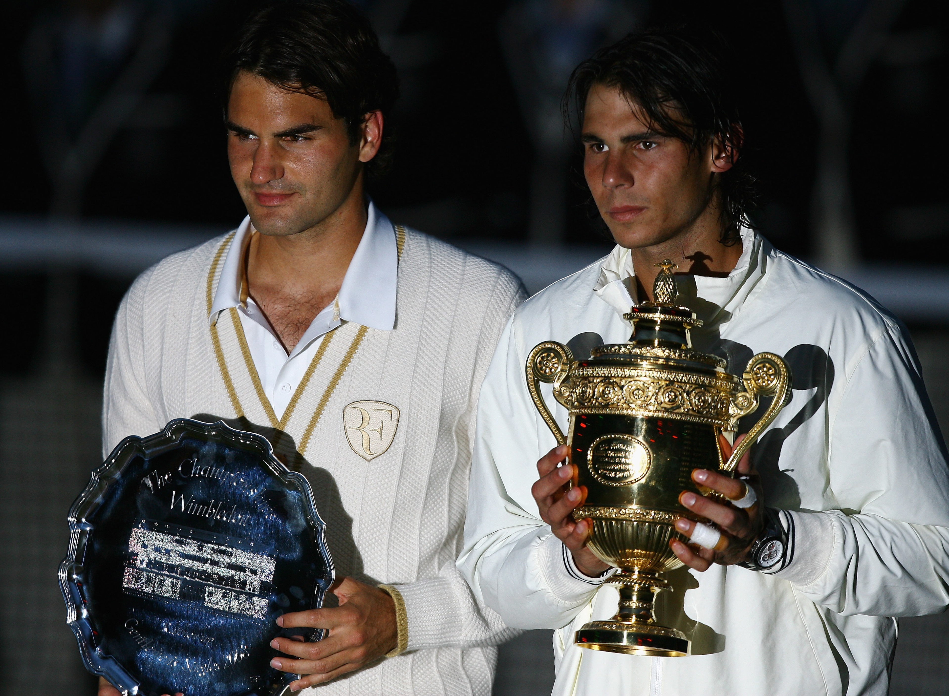 LONDON - JULY 06: Rafael Nadal of Spain and Roger Federer of Switzerland pose for pictures with after Nadal won in five sets in the final on day thirteen of the Wimbledon Lawn Tennis Championships at the All England Lawn Tennis and Croquet Club on July 6 LONDON - JULY 06: Rafael Nadal of Spain and Roger Federer of Switzerland pose for pictures with after Nadal won in five sets in the final on day thirteen of the Wimbledon Lawn Tennis Championships at the All England Lawn Tennis and Croquet Club on July 6