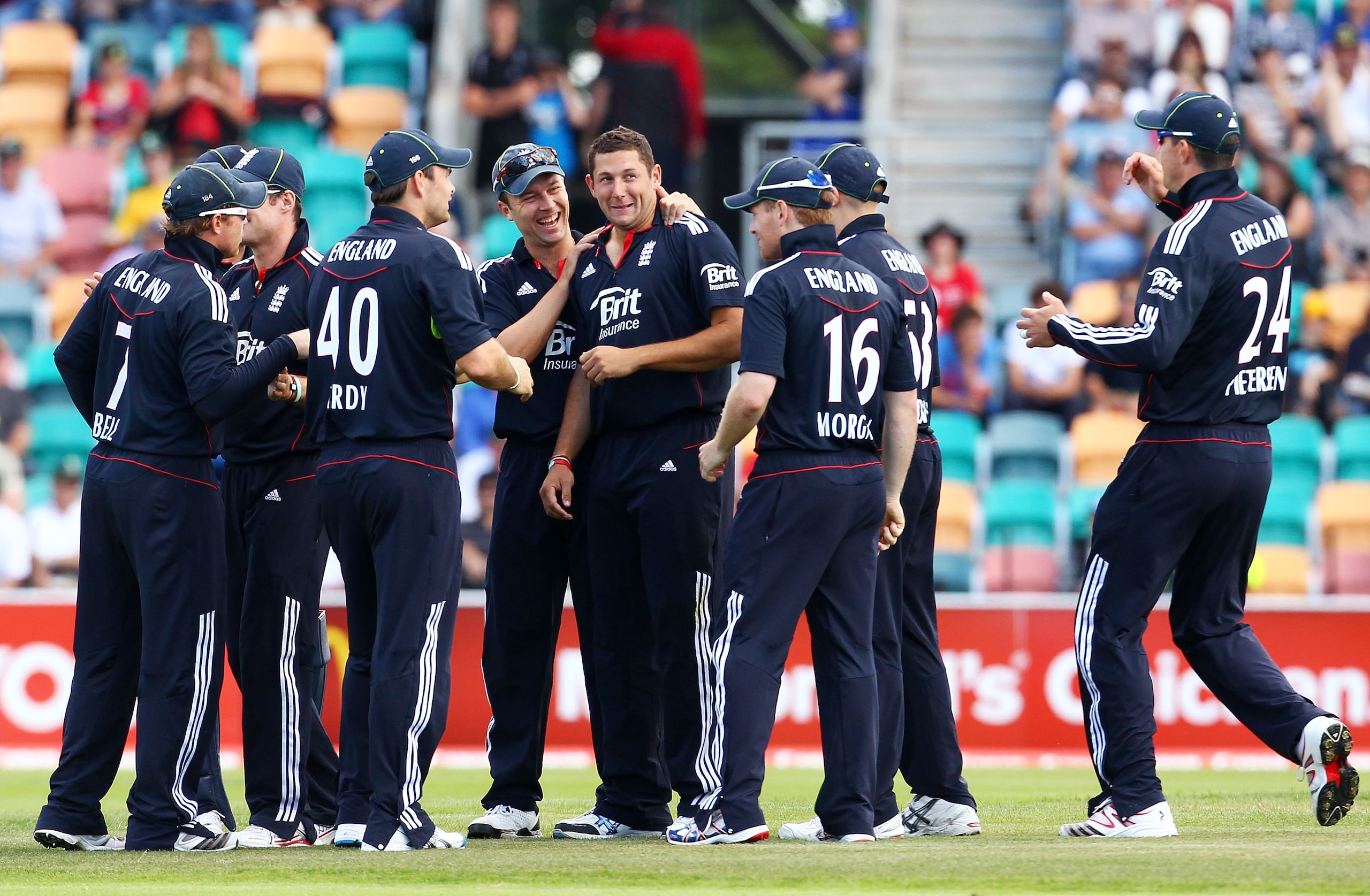 HOBART, AUSTRALIA - JANUARY 21: Tim Bresnan of England is congratulated by team mates after getting the wicket of Michael Clarke of Australia during game two of the Commonwealth Bank One Day International Series between Australia and England at Bellerive