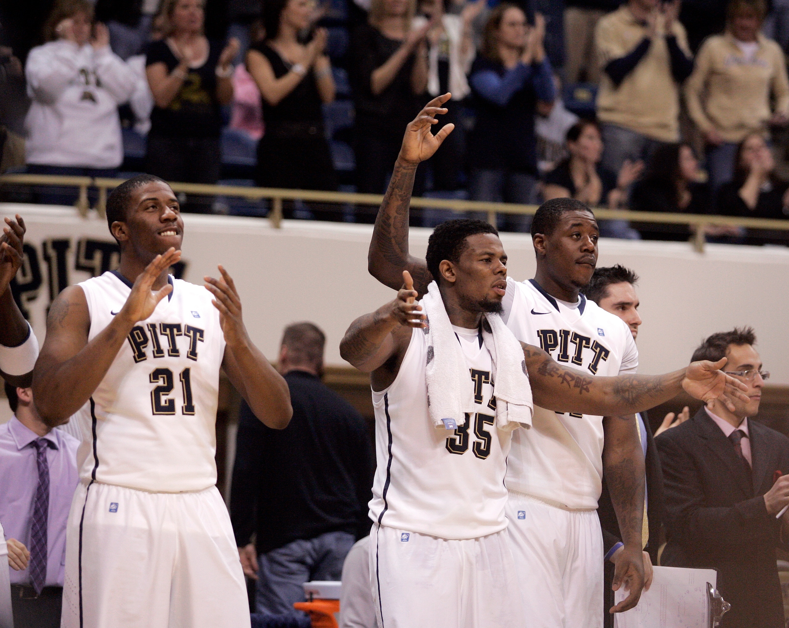 PITTSBURGH, PA - JANUARY 17:  Nasir Robinson #35, Lamar Patterson #21 and Dante Taylor #11 of the Pittsburgh Panthers celebrate near the end of the game against the Syracuse Orange at Petersen Events Center on January 17, 2011 in Pittsburgh, Pennsylvania.