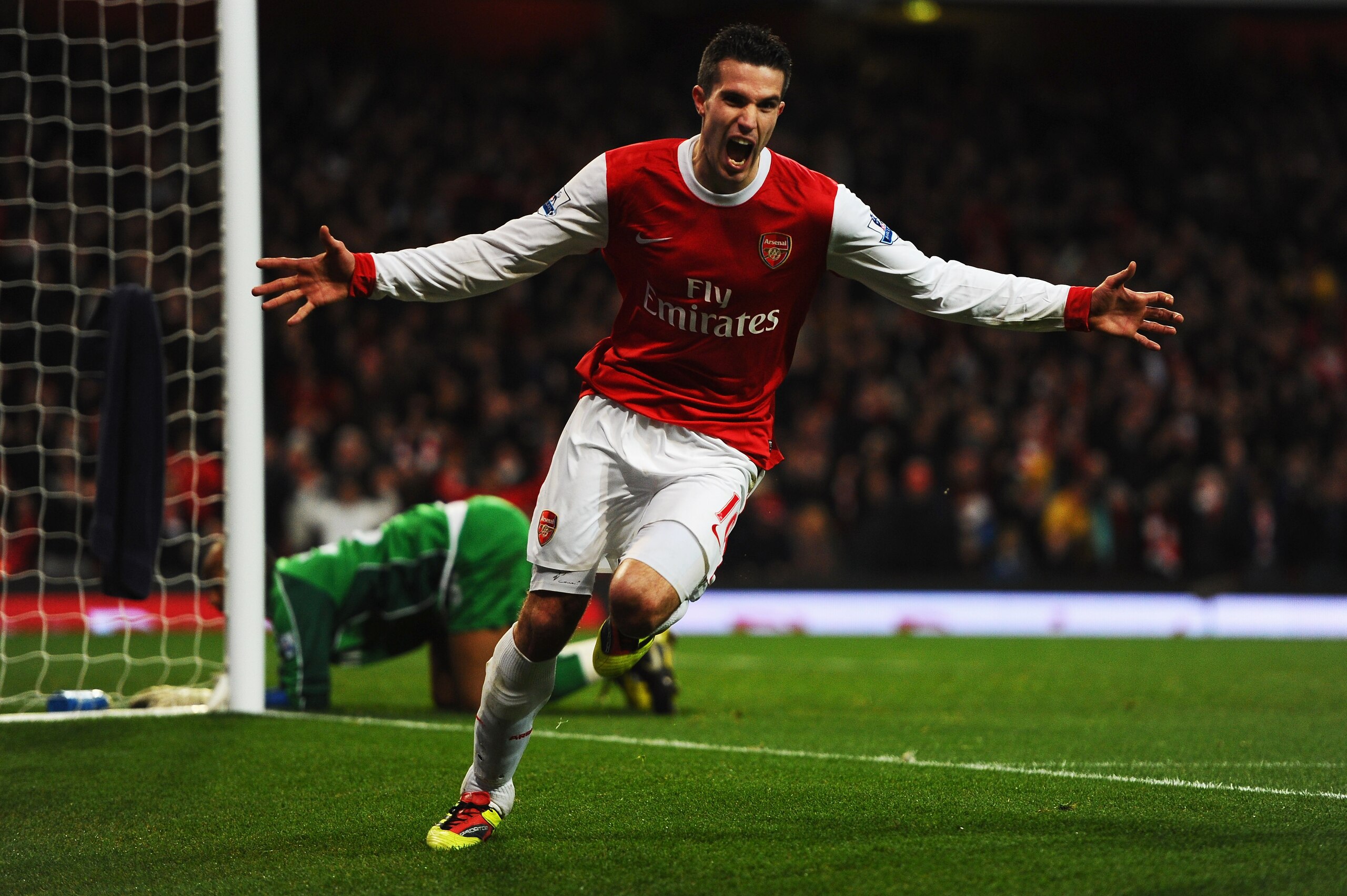 LONDON, UNITED KINGDOM - JANUARY 22: Robin Van Persie of Arsenal celebrates scoring his third goal in a hat trick during the Barclays Premier League match between Arsenal and Wigan Athletic at the Emirates Stadium on January 22, 2011 in London, England. LONDON, UNITED KINGDOM - JANUARY 22: Robin Van Persie of Arsenal celebrates scoring his third goal in a hat trick during the Barclays Premier League match between Arsenal and Wigan Athletic at the Emirates Stadium on January 22, 2011 in London, England.