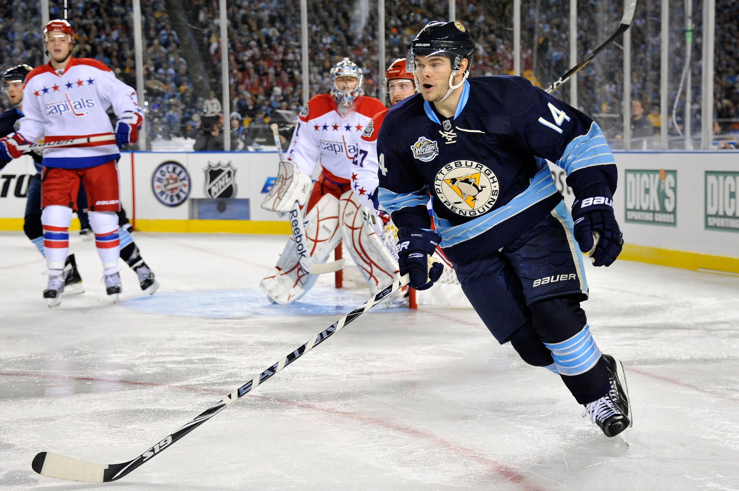 PITTSBURGH, PA - JANUARY 01:  Chris Kunitz #14 of the Pittsburgh Penguins skates against the Washington Capitals during the 2011 NHL Bridgestone Winter Classic at Heinz Field on January 1, 2011 in Pittsburgh, Pennsylvania. Washington won 3-1. (Photo by Ja
