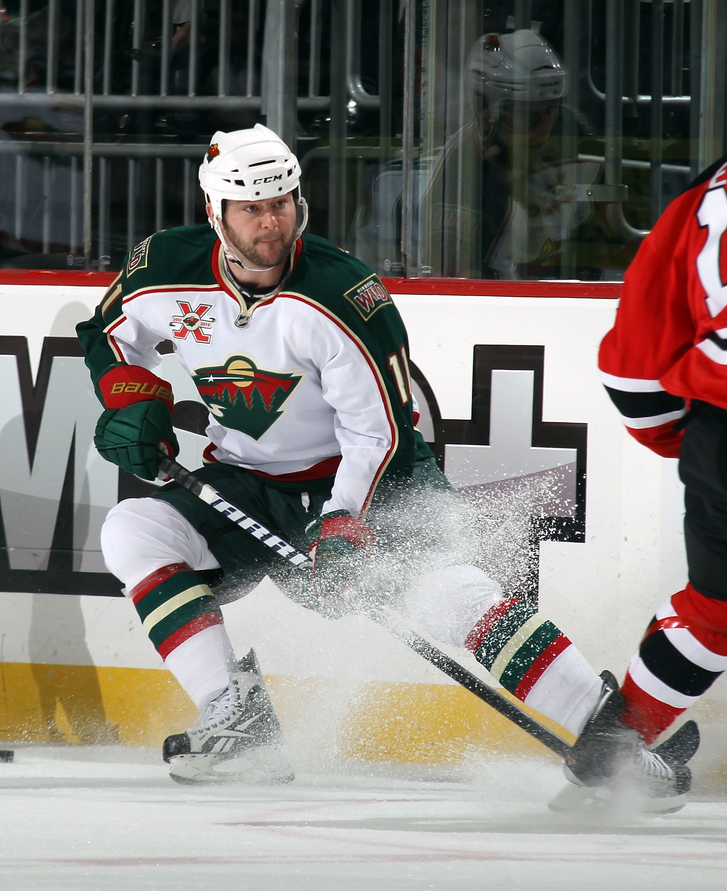 NEWARK, NJ - JANUARY 04:  John Madden #11 of the Minnesota Wild skates against the New Jersey Devils at the Prudential Center on January 4, 2011 in Newark, New Jersey. The Wild defeated the Devils 2-1.  (Photo by Bruce Bennett/Getty Images)