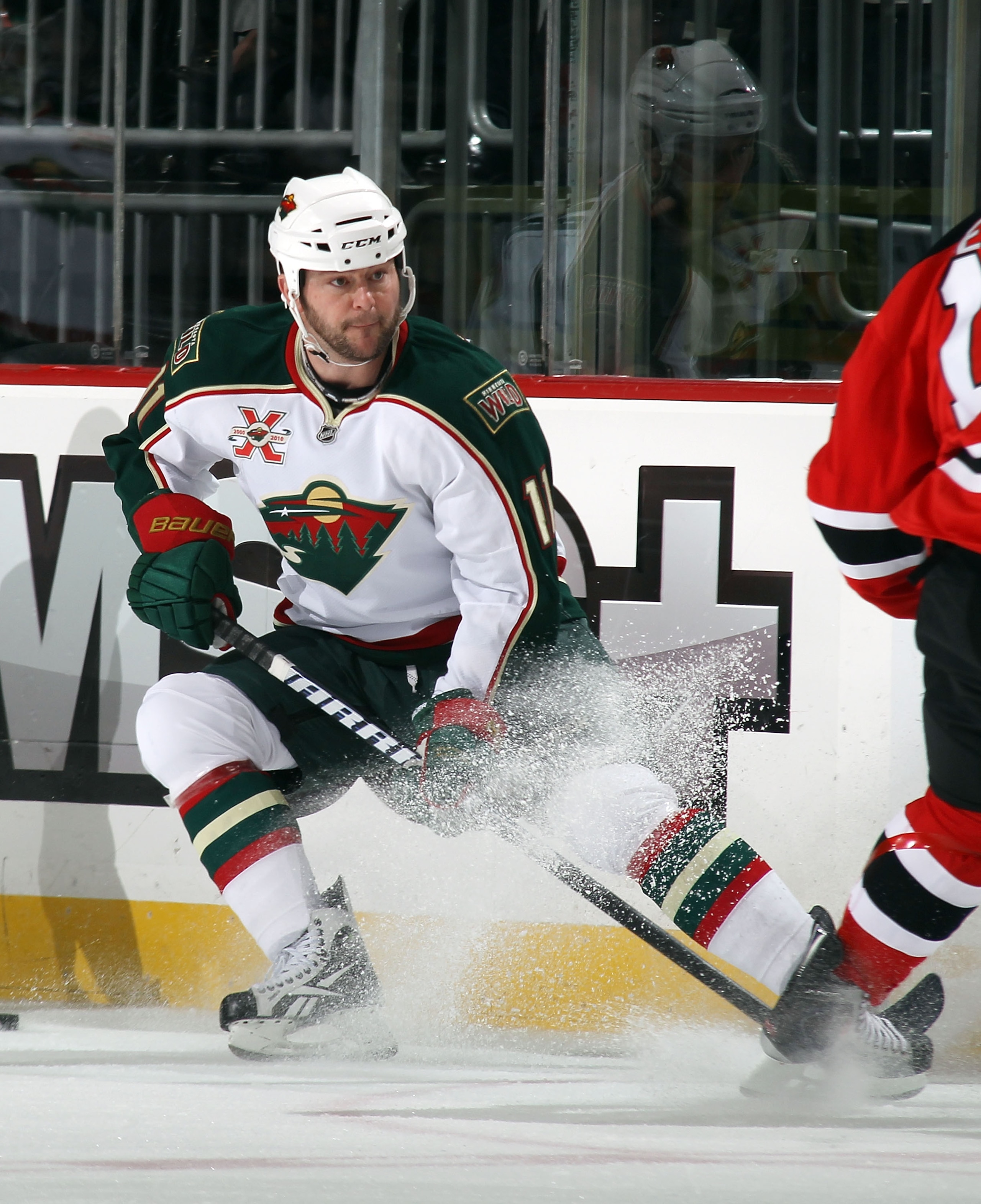 NEWARK, NJ - JANUARY 04:  John Madden #11 of the Minnesota Wild skates against the New Jersey Devils at the Prudential Center on January 4, 2011 in Newark, New Jersey. The Wild defeated the Devils 2-1.  (Photo by Bruce Bennett/Getty Images)
