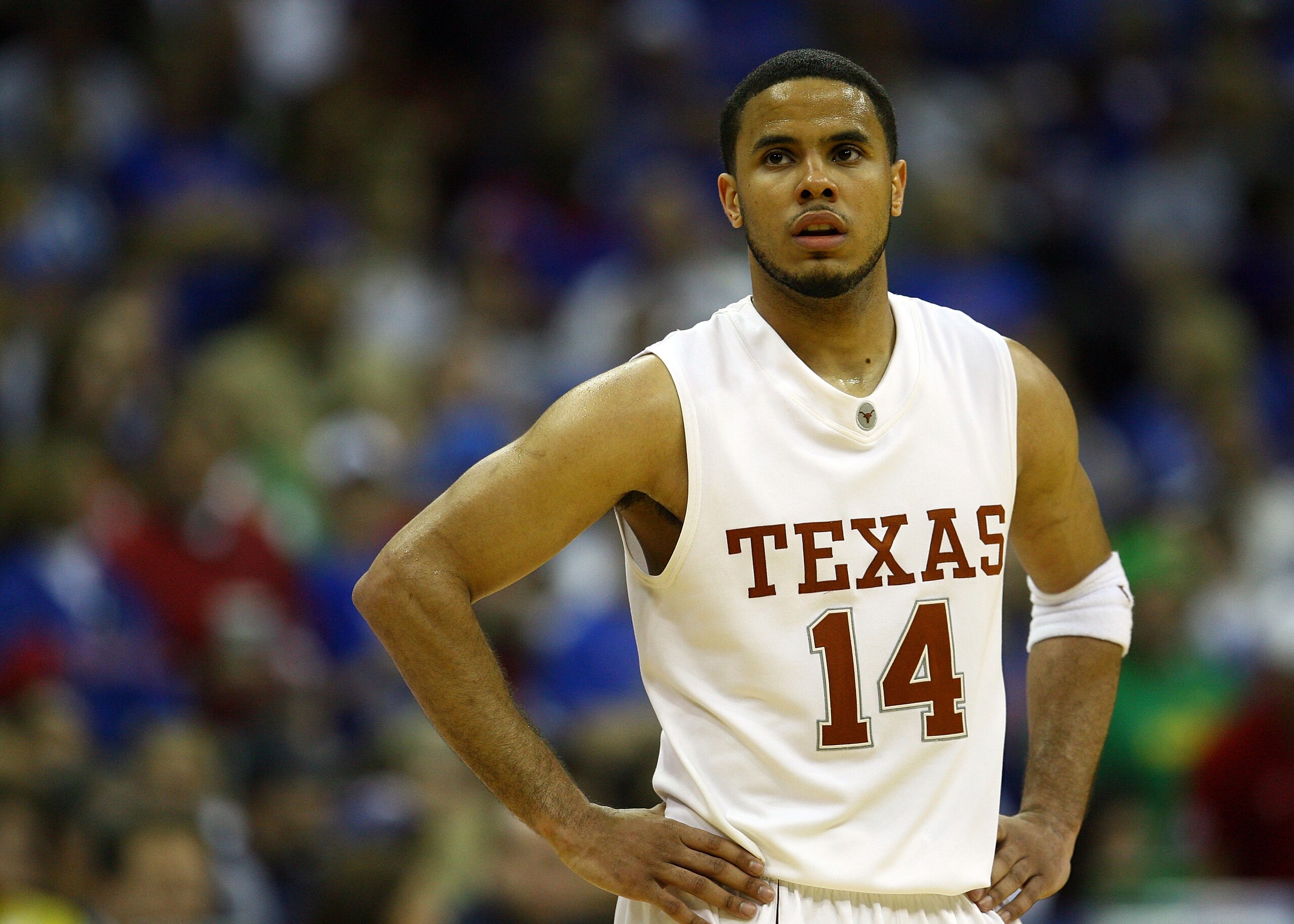 KANSAS CITY, MO - MARCH 16:  D.J. Augustin #14 of the Texas Longhorns walks back to the bench as the Kansas Jayhawks defeat the Longhorns to win the Big 12 Men's Basketball Tournament Finals on March 16, 2008 at the Sprint Center in Kansas City, Missouri.
